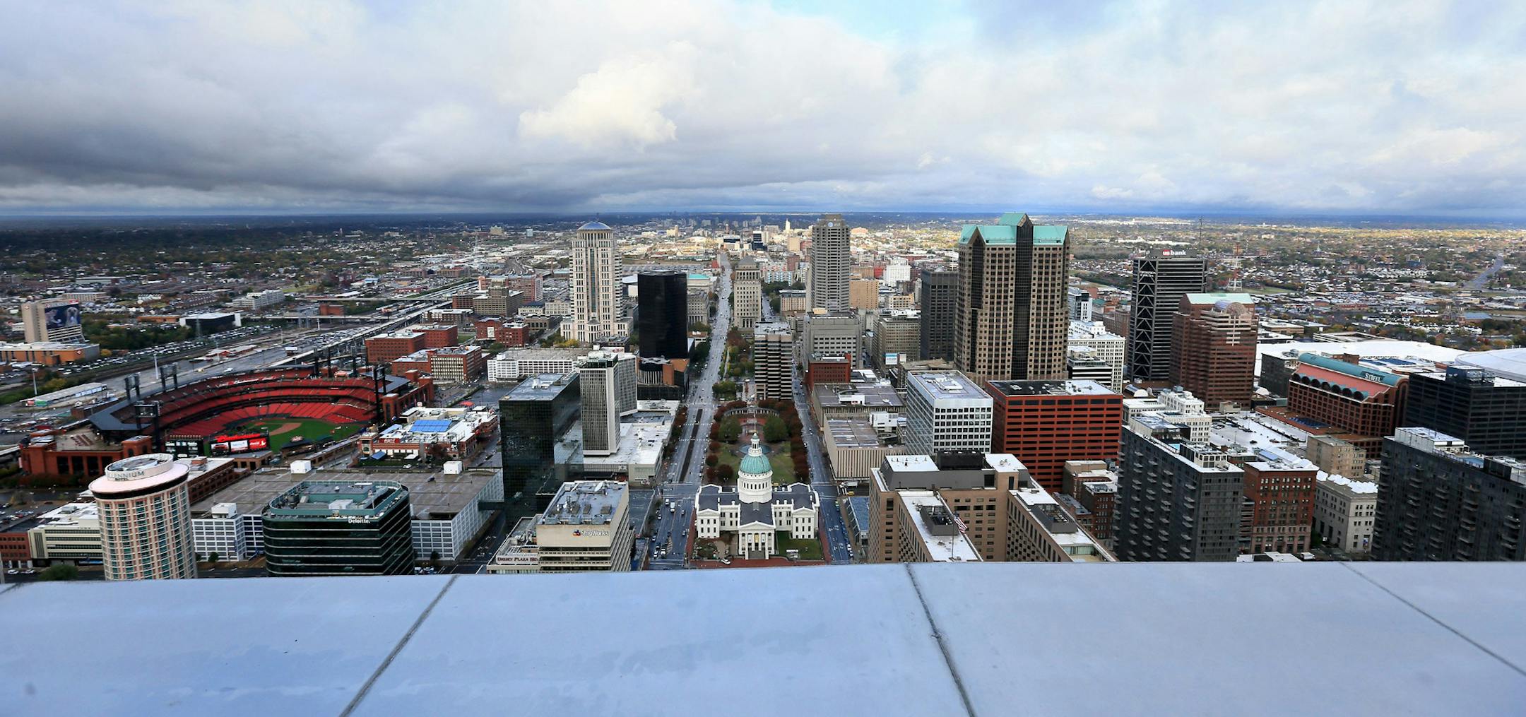 A view of the St. Louis skyline from 630 feet up, looking out of a portal on top the Gateway Arch.