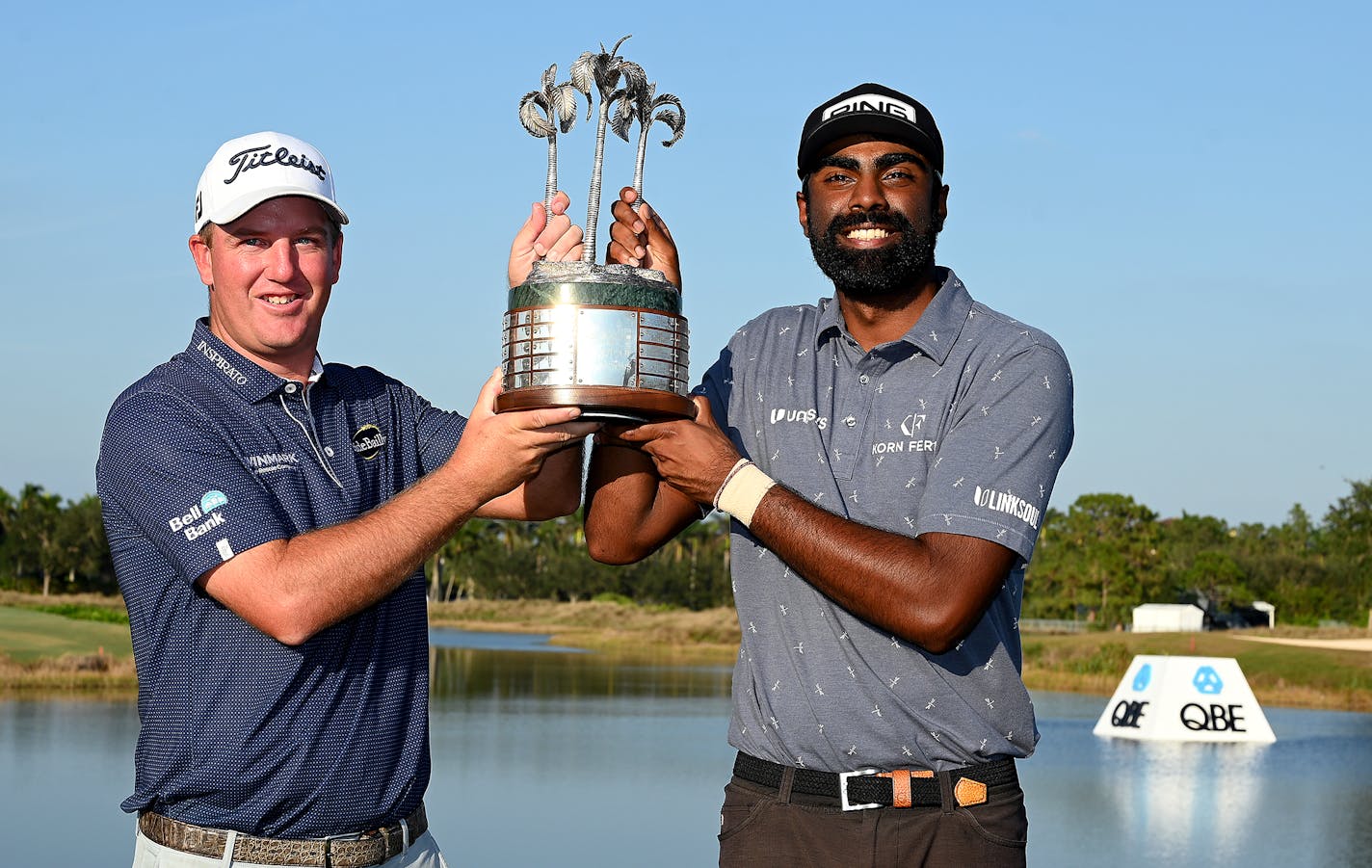 Tom Hoge and Sahith Theegala pose after winning the QBE Shootout at the Tiburon Golf Club on Sunday