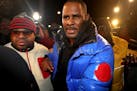 R. Kelly turns himself in at 1st District police headquarters in Chicago on Friday, Feb. 22, 2019.