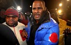 R. Kelly turns himself in at 1st District police headquarters in Chicago on Friday, Feb. 22, 2019.