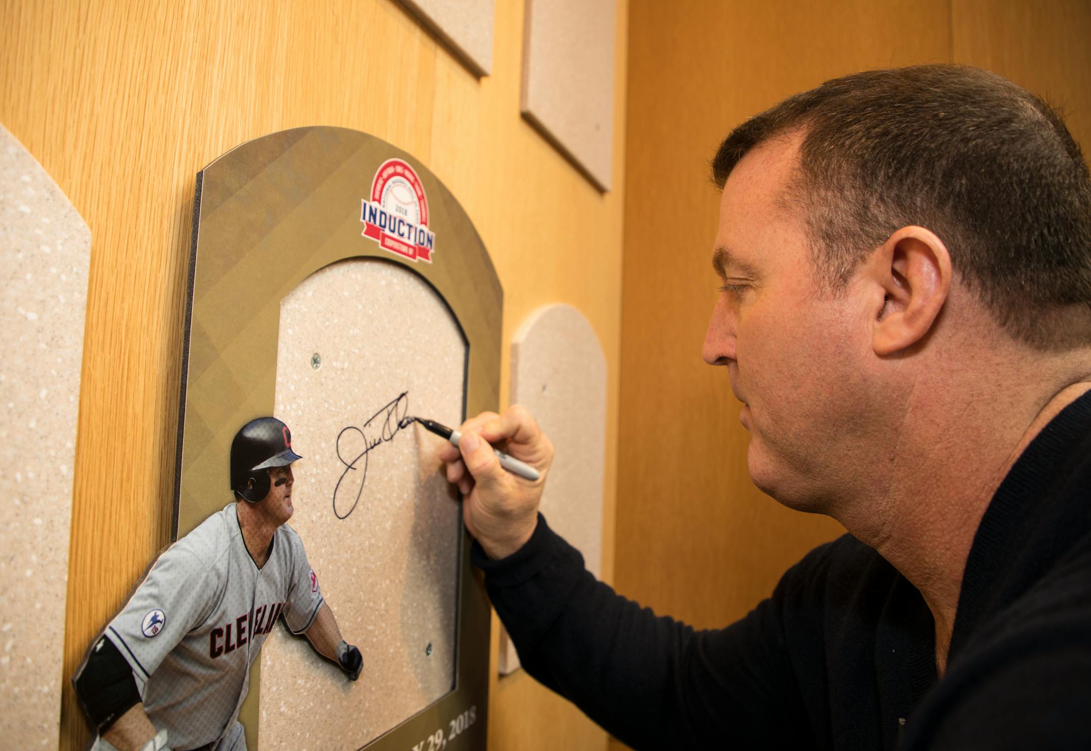 In this photo provided by the National Baseball Hall of Fame and Museum, former Twins slugger Jim Thome signed his name in the Plaque Gallery during his orientation tour of the National Baseball Hall of Fame and Museum in February.