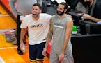 Minnesota Timberwolves guard Ricky Rubio, right, and Utah Jazz forward Georges Niang, left, share a moment before an NBA basketball game Saturday, Dec