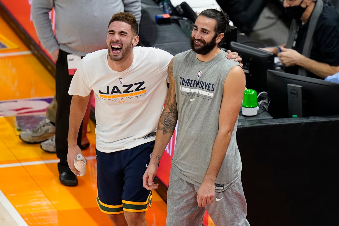 Minnesota Timberwolves guard Ricky Rubio, right, and Utah Jazz forward Georges Niang, left, share a moment before an NBA basketball game Saturday, Dec. 26, 2020, in Salt Lake City. (AP Photo/Rick Bowmer)