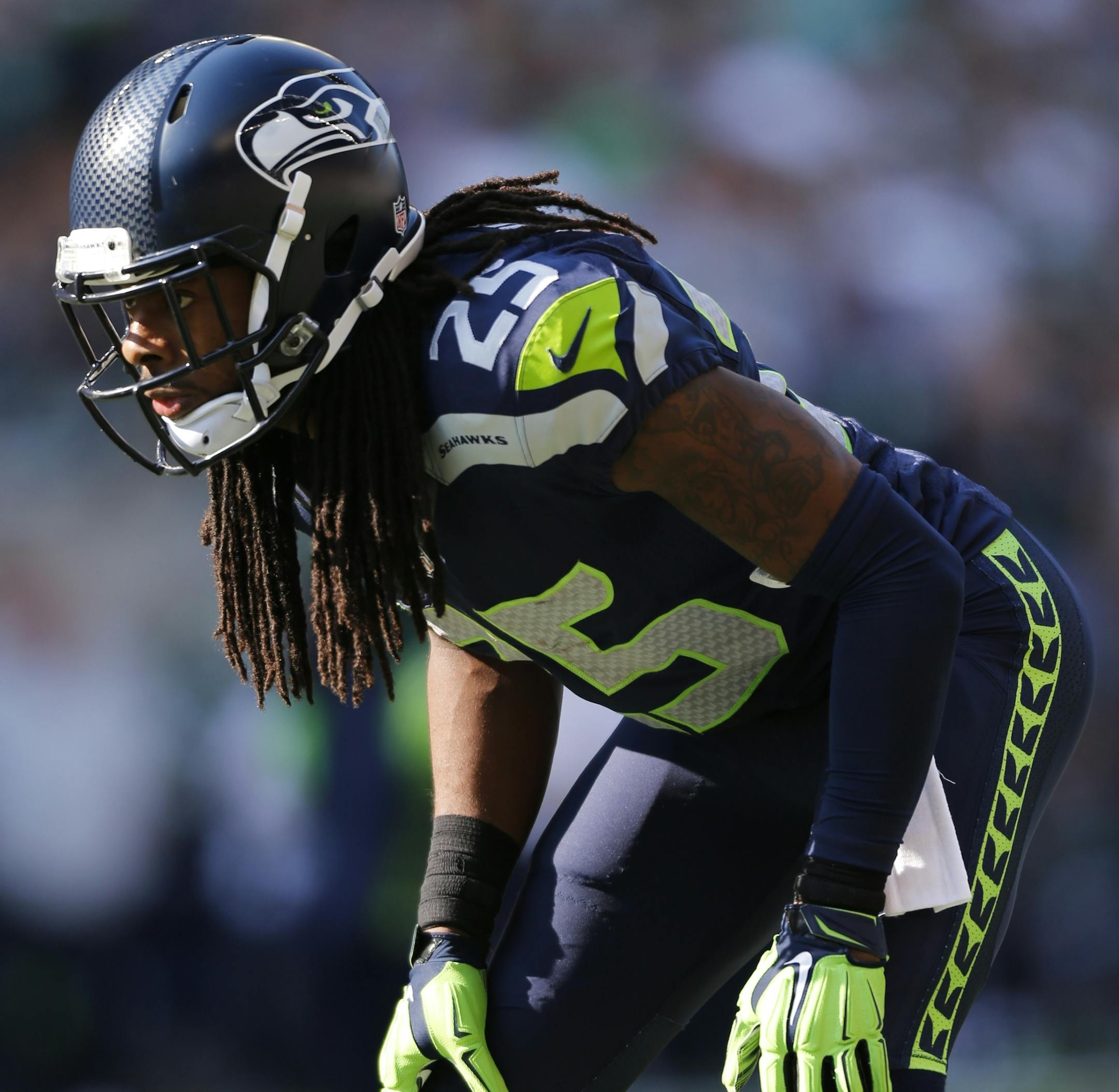FILE - In this Sept. 21, 2014, file photo, Seattle Seahawks cornerback Richard Sherman lines up against the Denver Broncos in the second half of an NFL football game in Seattle. The four straight wins by Dallas ranks near the top among early-season surprises across the league. The Cowboys face the defending champion Seahawks on Sunday, Oct. 12. (AP Photo/John Froschauer)