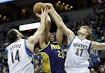 Earlier this month, Anthony Davis, center, was double-teamed on a shot attempt by Minnesota Timberwolves' Nikola Pekovic of Montenegro, left, and Andr
