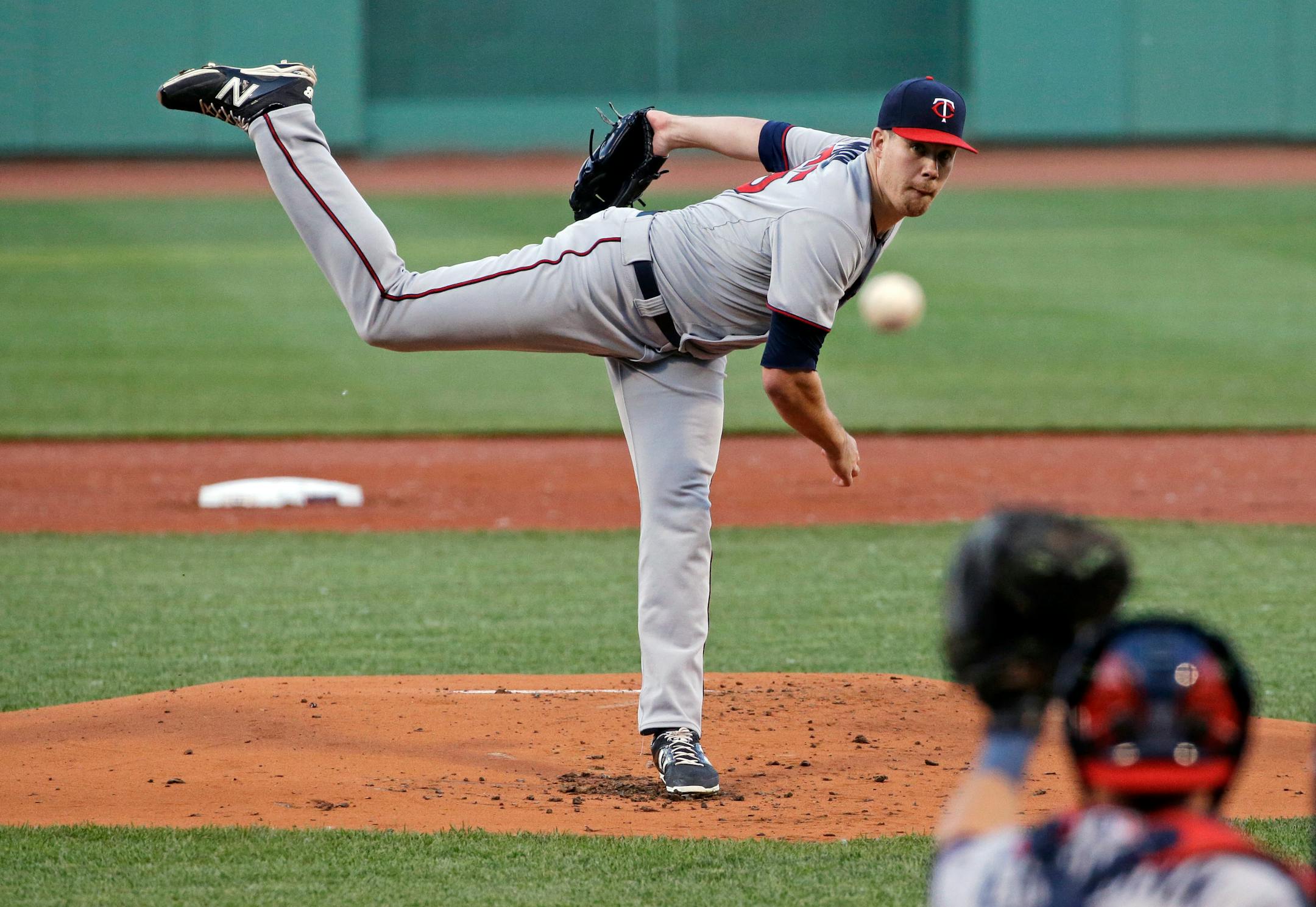 Minnesota Twins starting pitcher Trevor May delivers to the Boston Red Sox with Twins catcher Chris Herrmann behind the plate in the first inning of a baseball game at Fenway Park in Boston, Wednesday, June 3, 2015. (AP Photo/Elise Amendola)