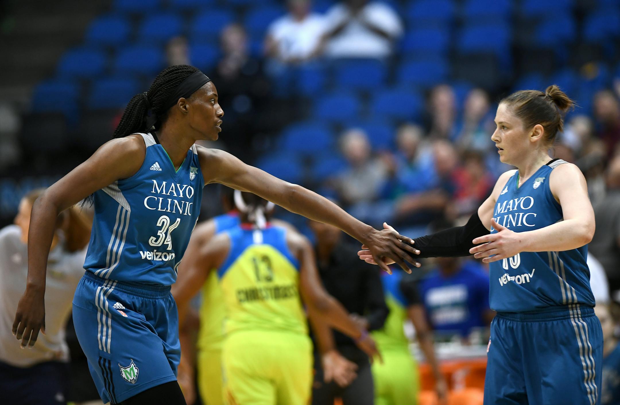 Minnesota Lynx forward Keisha Hampton (24) and guard Lindsay Whalen (13) high fived after a couple quick baskets forced a Dallas timeout in the first quarter Saturday night. ] (AARON LAVINSKY/STAR TRIBUNE) aaron.lavinsky@startribune.com The Minnesota Lynx play the Dallas Wings on Saturday, June 4, 2016 at Target Center in Minneapolis, Minn.