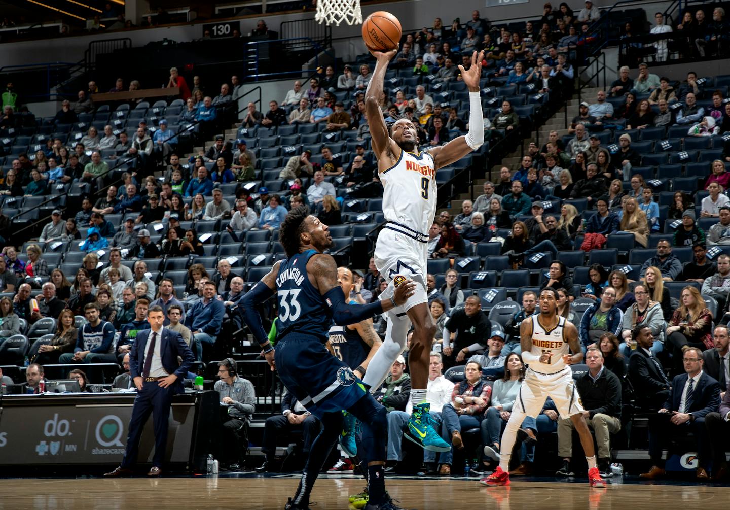 Denver's Jerami Grant was defended by Robert Covington of the Timberwolves on Jan. 20.