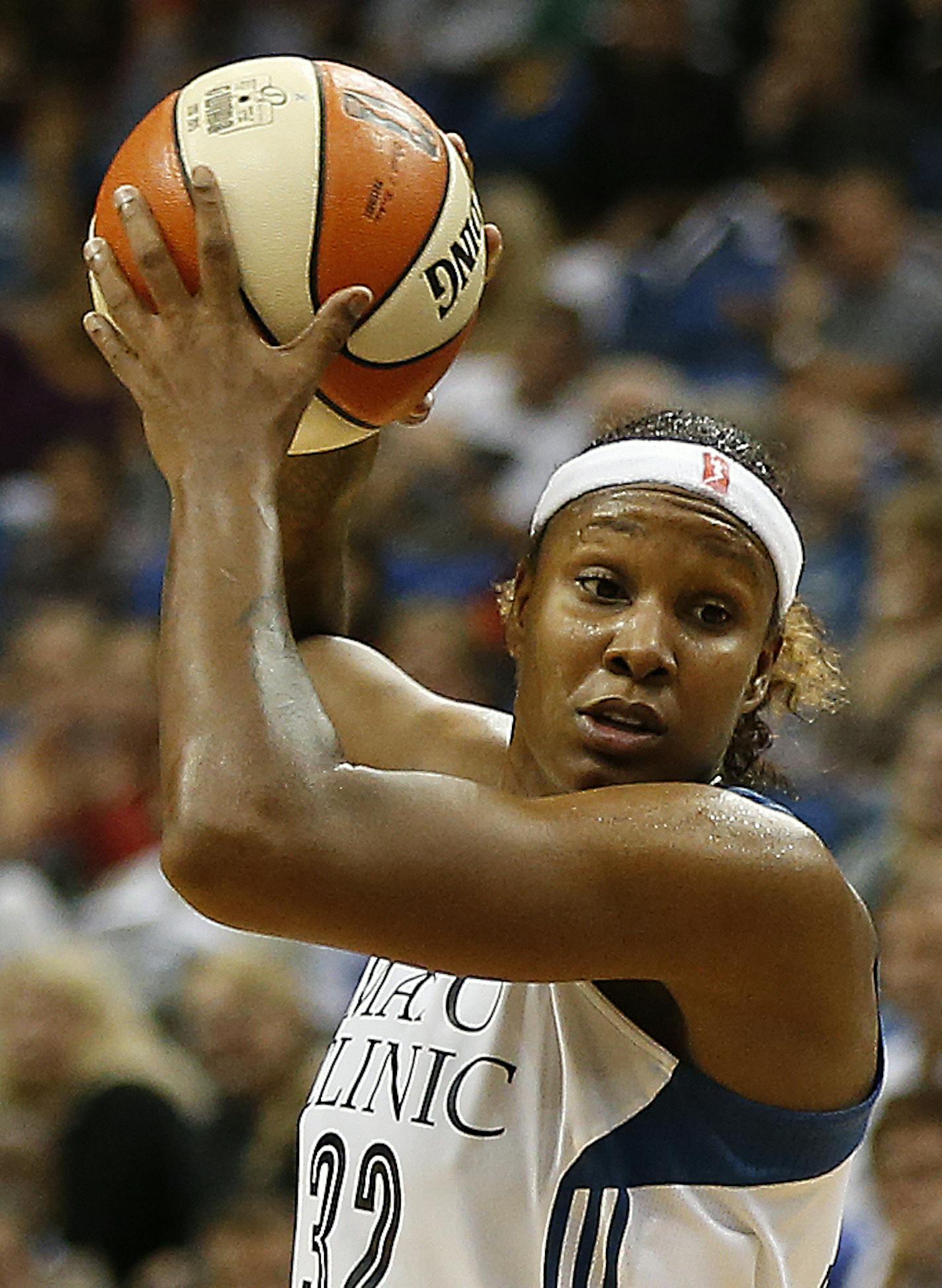 Minnesota Lynx forward Rebekkah Brunson (32) protects the ball against the defense of Los Angeles Sparks center Candace Parker (3) during the second half of Game 3 of a WNBA basketball Western Conference semifinal series, Tuesday, Sept. 22, 2015, in Minneapolis. The Lynx won 91-80. (AP Photo/Stacy Bengs) ORG XMIT: MIN2015100218571048