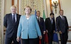 From the left, Britain's Prime Minister Boris Johnson, German Chancellor Angela Merkel, French President Emmanuel Macron, Italian Premier Giuseppe Con