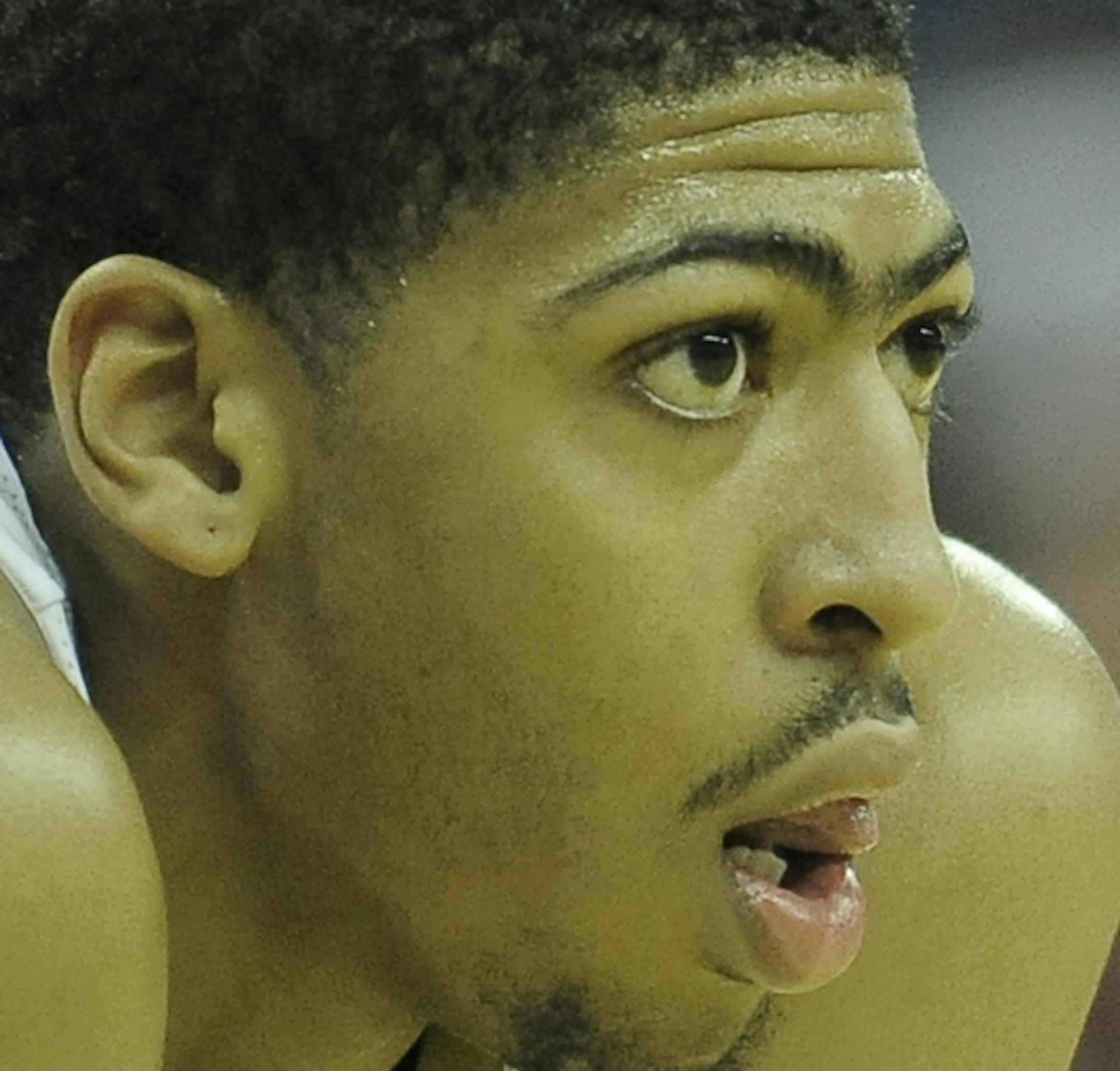 New Orleans Pelicans center Anthony Davis (23) waits for a free throw during the second half of an NBA basketball game against the Denver Nuggets in New Orleans, Friday, Dec. 27, 2013. New Orleans won the game 105-89. (AP Photo/Stacy Revere)