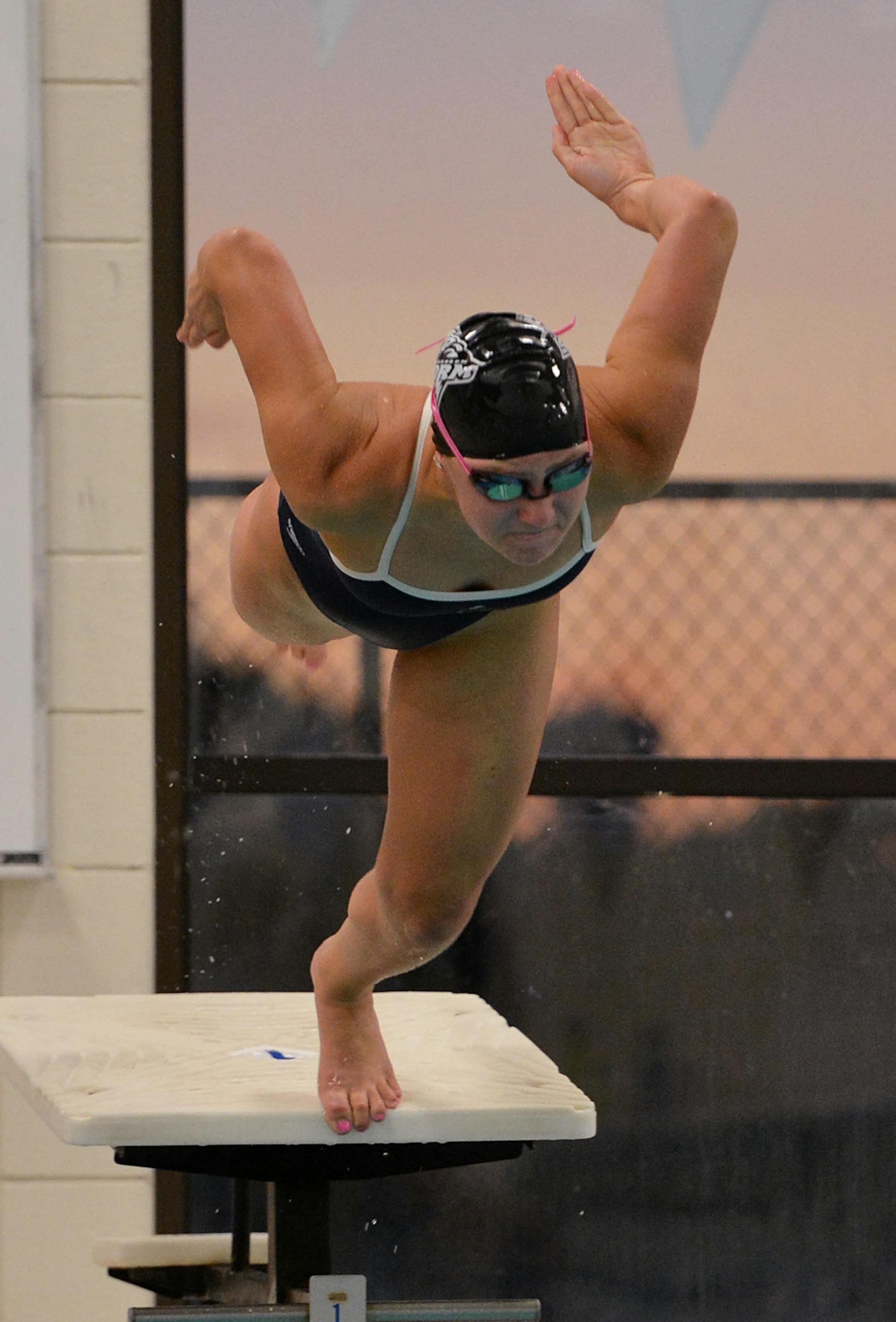 Junior Kaia Grobe dives off the block to begin the 50 yard freestyle during practice Friday, September 13 at Chaska Middle School. ] (SPECIAL TO THE STAR TRIBUNE/BRE McGEE) **Kaia Grobe