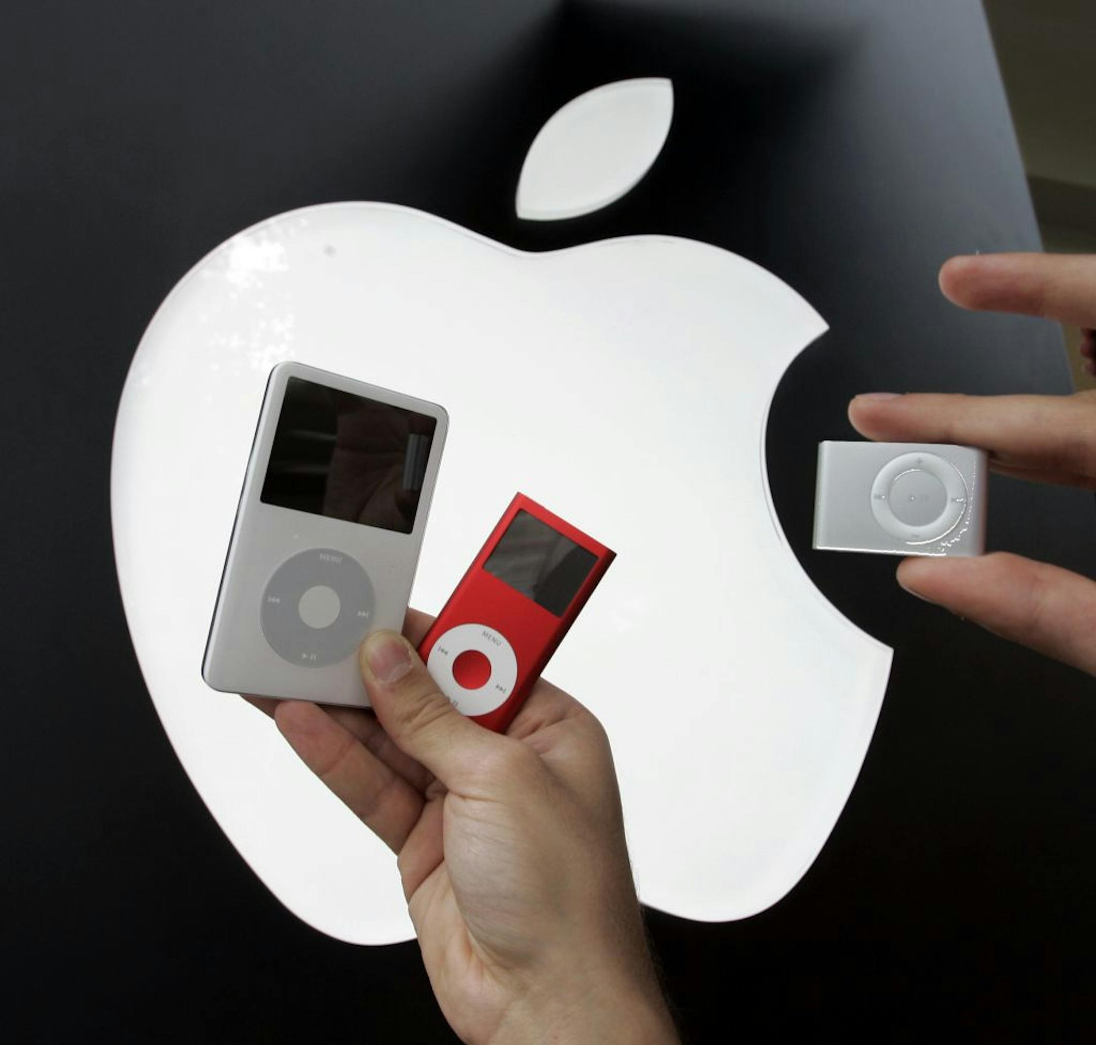 This 2006 file photo shows the then new Apple iPod Shuffle, right, next to a Red iPod Nano, center, and 60GB iPod, left.