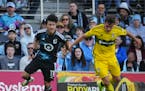 Minnesota United forward Sang-Bin Jeong battles Columbus Crew defender Malte Amundsen for the ball in the first half Saturday at Allianz Field in the 