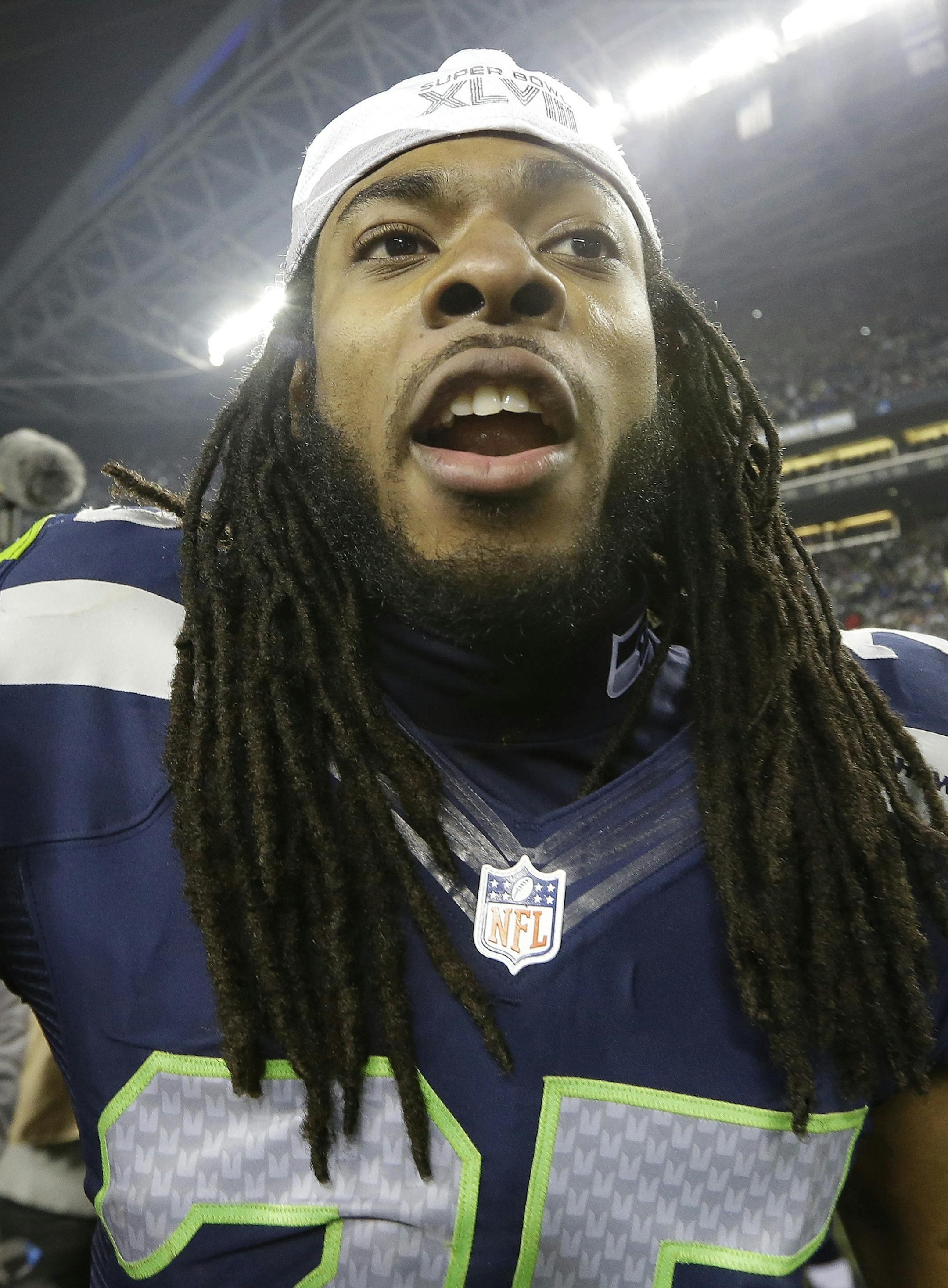 Seattle Seahawks' Richard Sherman celebrates after the NFL football NFC Championship game against the San Francisco 49ers, Sunday, Jan. 19, 2014, in Seattle. The Seahawks won 23-17 to advance to Super Bowl XLVIII. (AP Photo/Elaine Thompson)