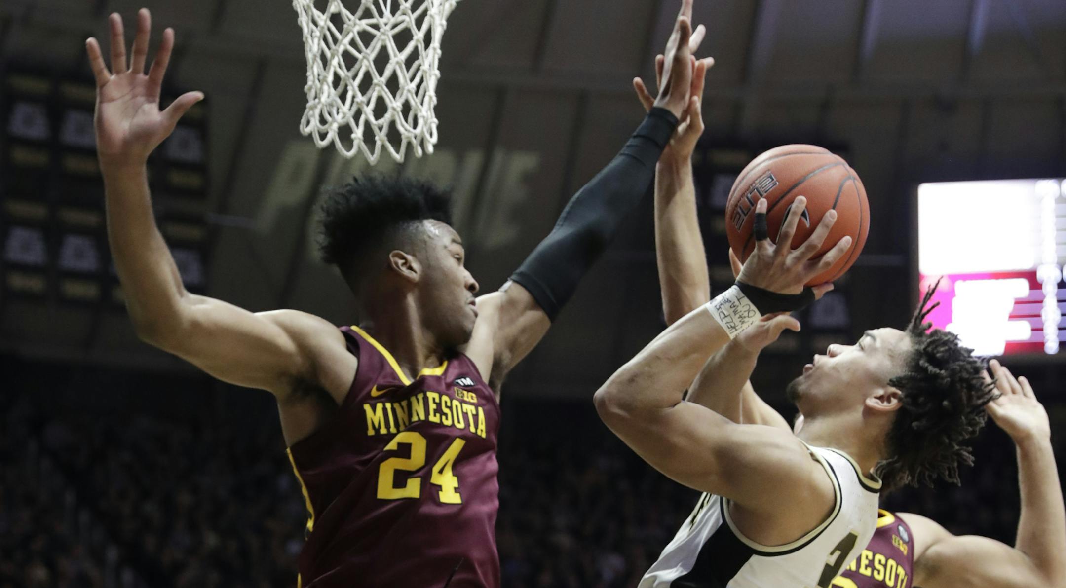 Purdue guard Carsen Edwards (3) shoots over Minnesota forward Eric Curry (24) during the second half of an NCAA college basketball game in West Lafayette, Ind., Sunday, Feb. 3, 2019. (AP Photo/Michael Conroy)