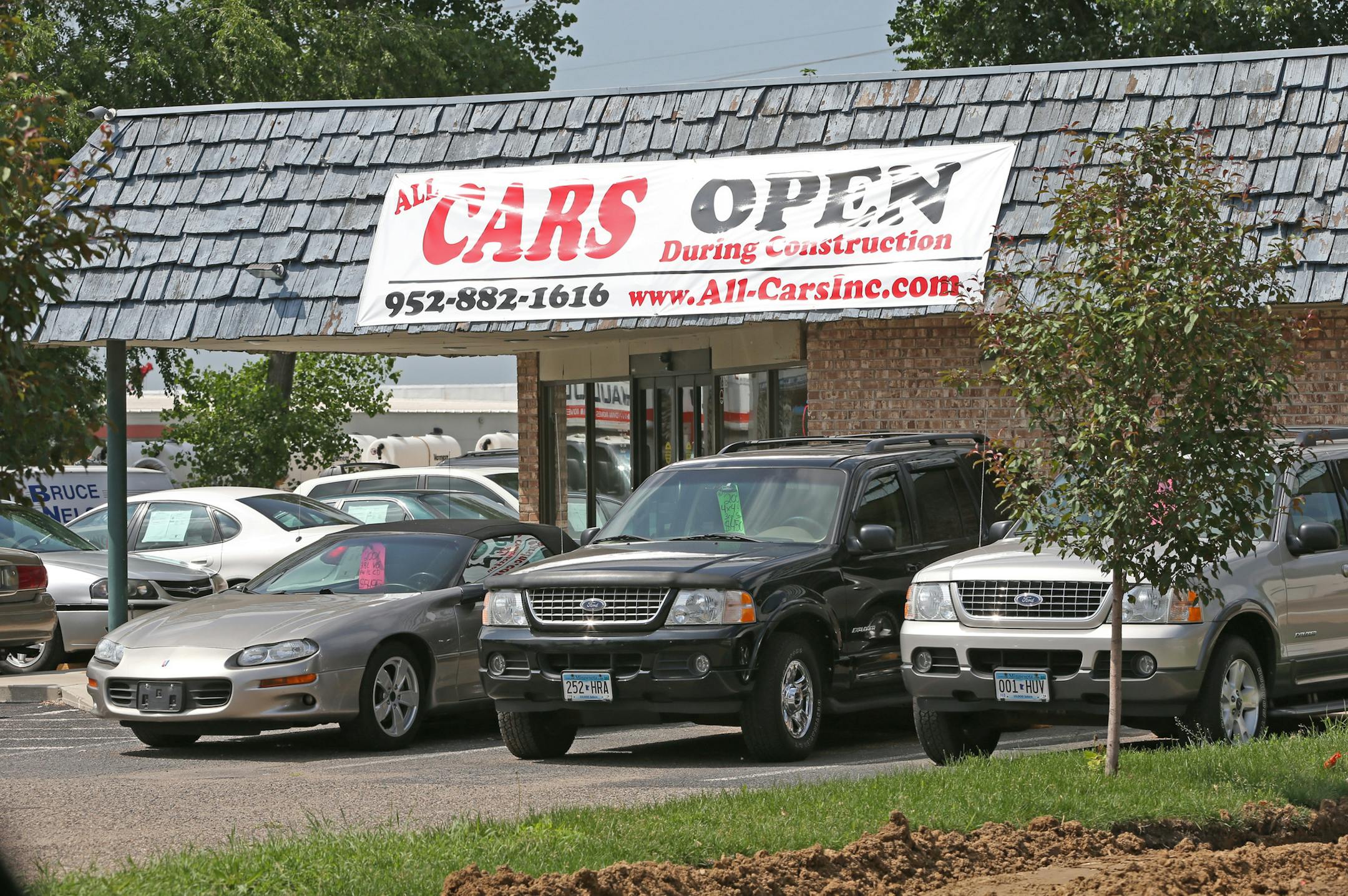 Many business locations along Hwy 13, including All Cars have open signs, as the new interchange being constructed at County Road 5 and Highway 13 in Burnsville is causing heavy traffic congestion on 6/25/13.] Bruce Bisping/Star Tribune bbisping@startribune.com