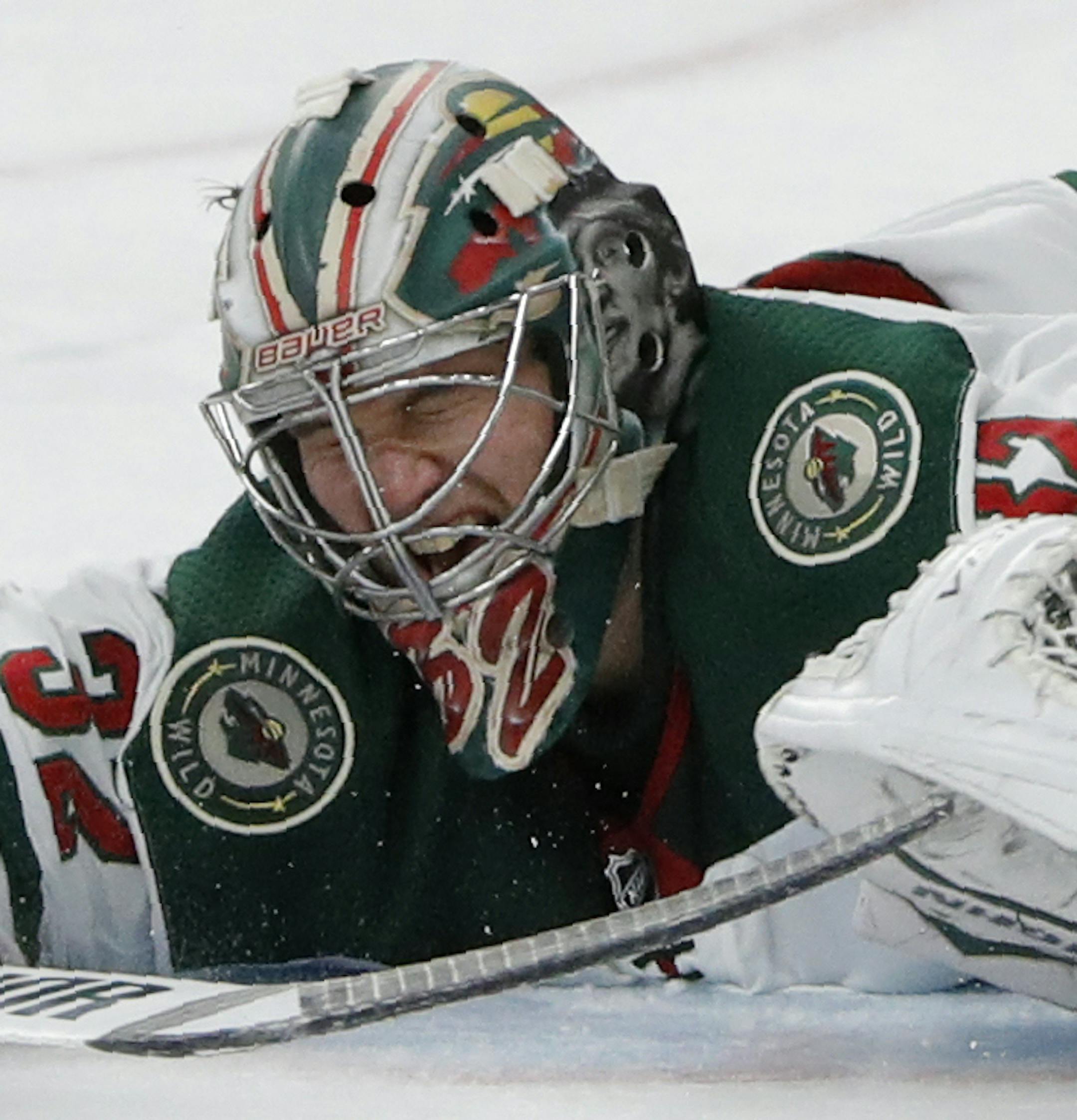 Minnesota Wild goaltender Alex Stalock blocks a shot by Vegas Golden Knights right wing Mark Stone during the second period of an NHL hockey game Tuesday, Dec. 17, 2019, in Las Vegas. (AP Photo/John Locher)