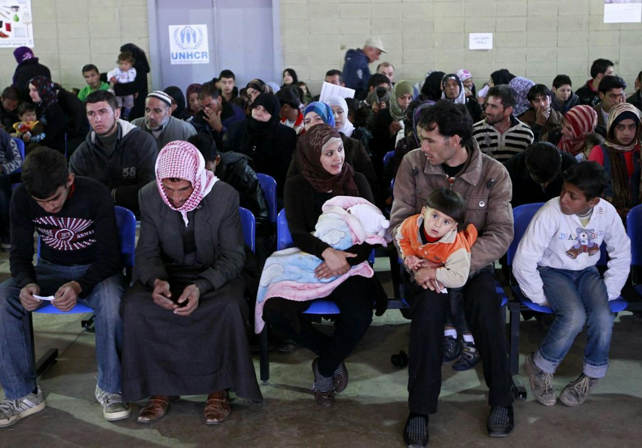 Syrian families wait their turn to register at the UNHCR center in the northern city of Tripoli, Lebanon, Wednesday, March. 6, 2013. The number of Syrians who have fled their war-ravaged country and are seeking assistance has now topped the one million mark, the United Nations� refugee agency said Wednesday warning that Syria is heading towards a "full-scale disaster."