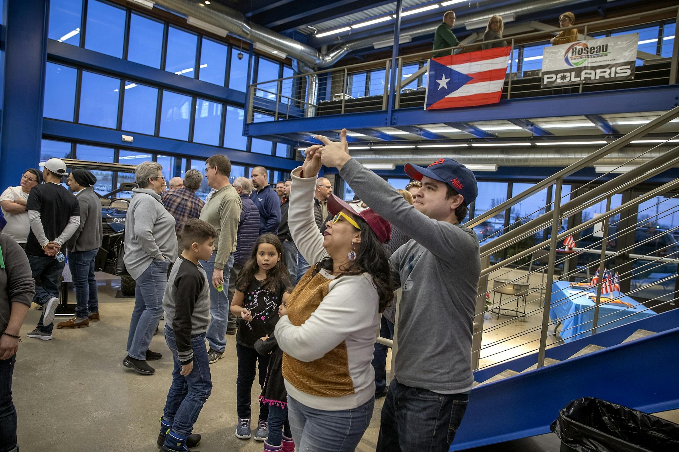 Karen Lopez Rivera, and her husband Edwin Colon Perez danced to salsa music during a community welcome party and open house that Polaris hosted for families from Puerto Rico and the community at the Polaris manufacturing plant, Monday, February 17, 2020 in Roseau, MN.