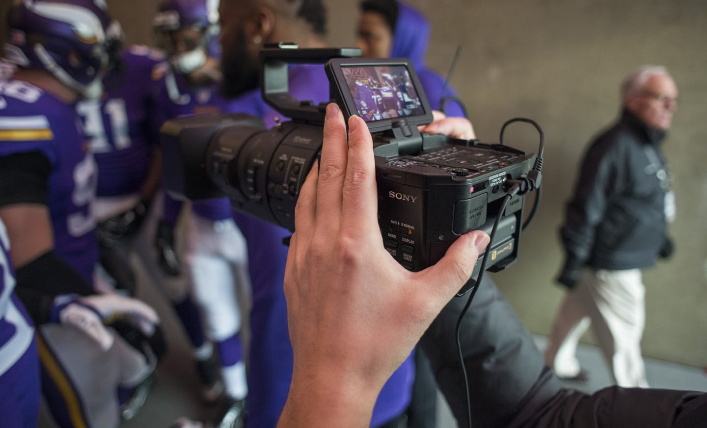 Mike Huiras shot video as players entreated the field during pre-game warmups. ] Mark Vancleave - mark.vancleave@startribune.com * The Vikings media team worked to capture and publish content before the game against the Chicago Bears on Sunday, Dec. 20, 2015 at TCF Bank Stadium.