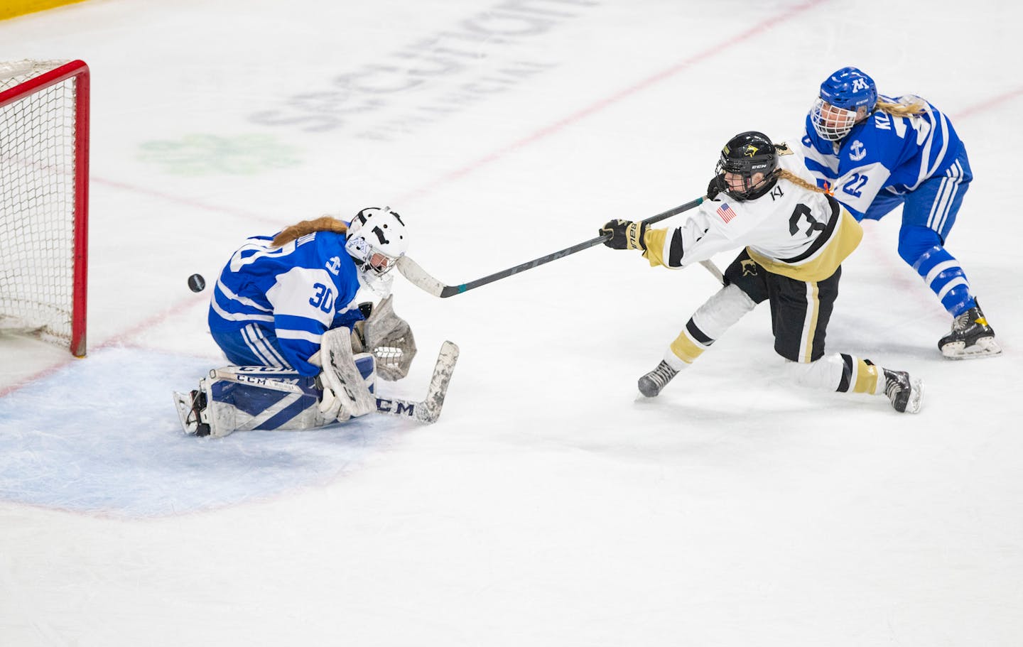 Andover forward Sara Kaiser (3) scores the game winning goal on Minnetonka goalkeeper Sophia Johnson (30) in the third period of the MSHSL state tournament Class 2A girls' hockey championship Saturday, Feb. 26, 2022 at Xcel Energy Center in St. Paul, Minn. ]