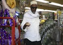 Hassan Amin carried his purchase of limes, a lemon, and some ginger to the counter as he joined Muslims in Minnesota in preparing for the fasting asso