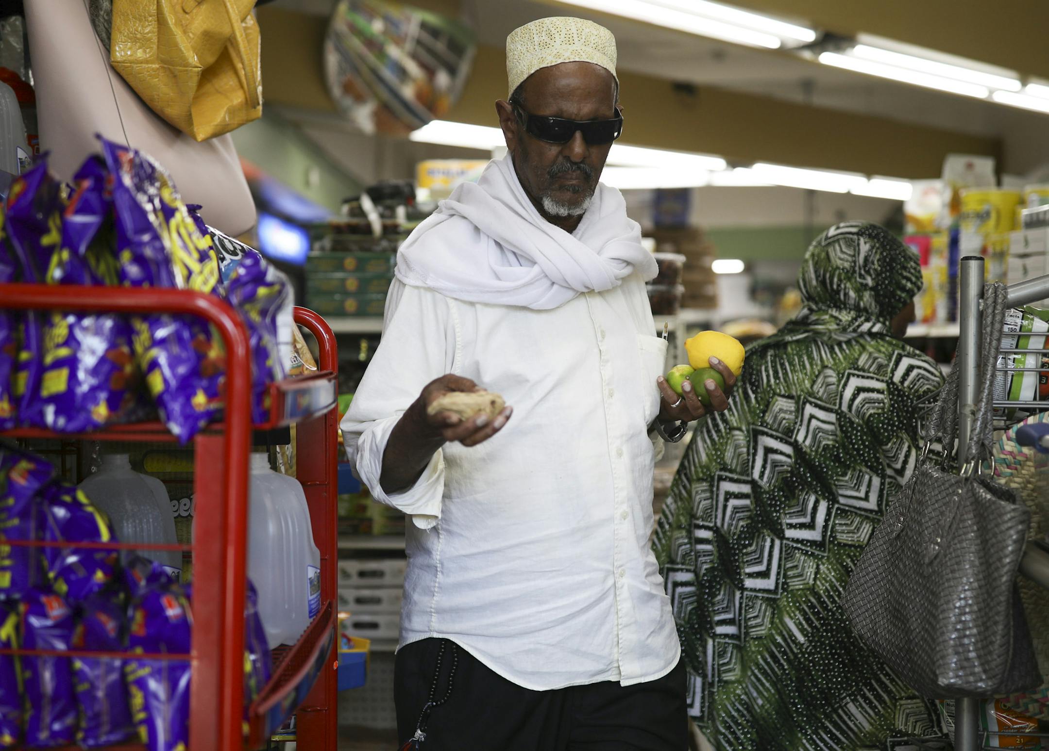Hassan Amin carried his purchase of limes, a lemon, and some ginger to the counter as he joined Muslims in Minnesota in preparing for the fasting associated with the month of Ramadan Wednesday afternoon. ] JEFF WHEELER ï jeff.wheeler@startribune.com It was busy at Wadajir Grocery & Halal Meat market on Cedar Ave. S. Wednesday afternoon, May 16, 2018 with a steady stream of neighborhood residents stocking up on traditional foods eaten to break the fast at the start of Ramadan.