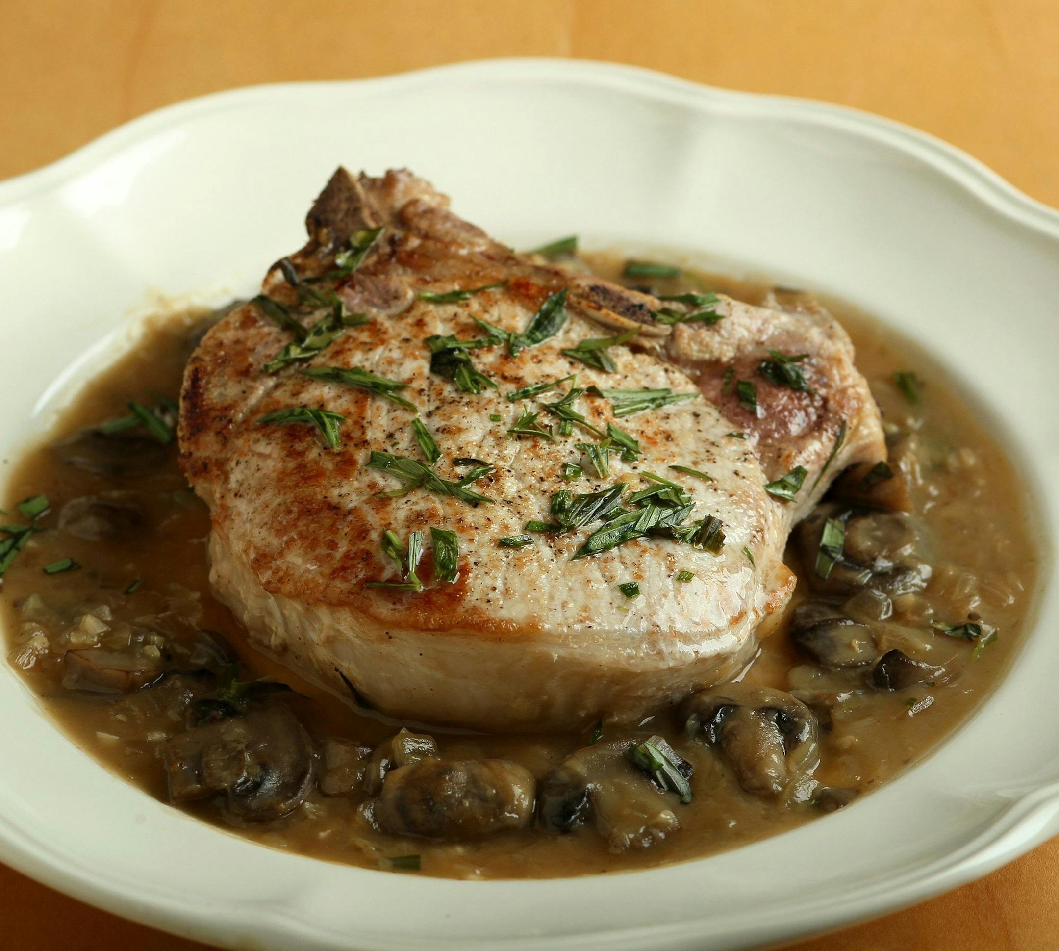 Tarragon can be used as an excellent complement to pork, such as in pork chops with mushroom-tarragon sauce. (Roberto Rodriguez/St. Louis Post-Dispatch/MCT) ORG XMIT: 1156938