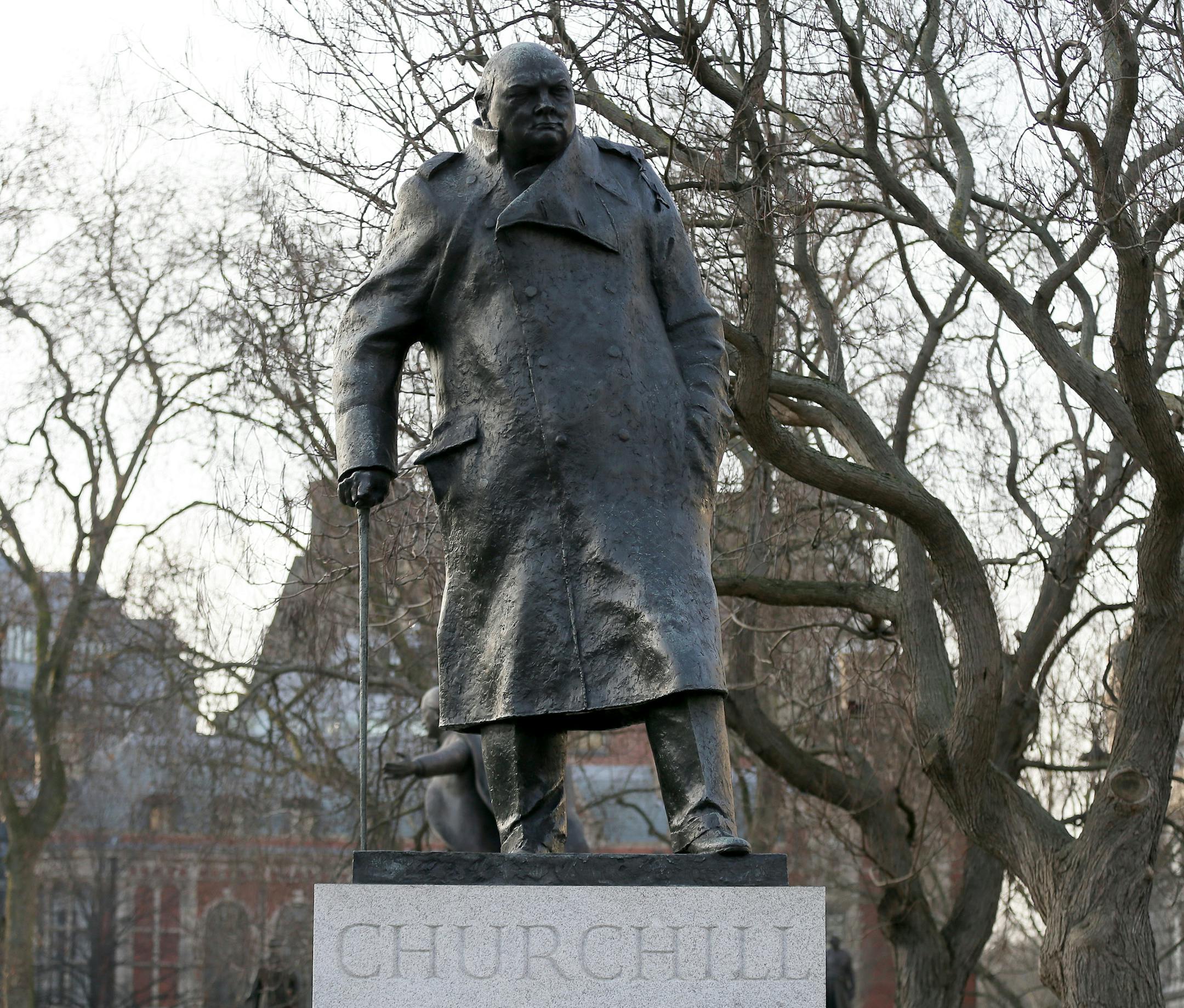 A bronze statue of Britain's World War II leader Sir Winston Churchill, by sculptor Ivor Roberts-Jones, stands in Parliament Square, London, Friday, Jan. 23, 2015. Saturday marks the 50th anniversary of the death of Churchill, who twice served as Britainís Prime Minister and died in London aged 90 on January 24, 1965. (AP Photo/Tim Ireland)