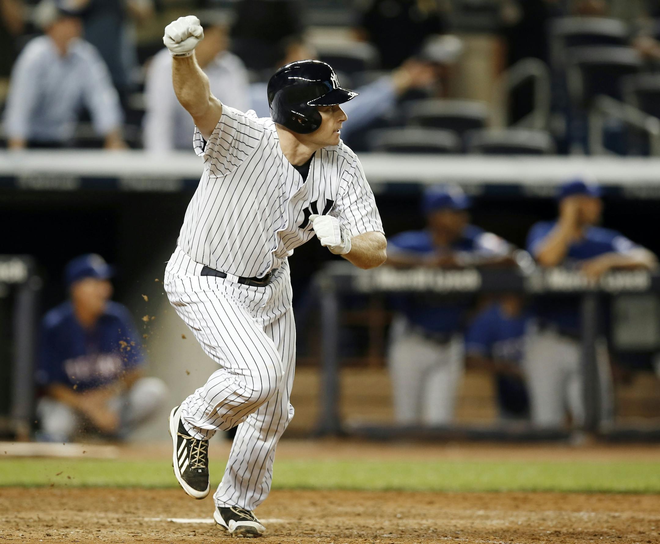 New York Yankees Chase Headley celebrates after hitting a 14th-inning walk-off RBI single in the Yankees 2-1 victory over the Texas Rangers in a baseball game at Yankee Stadium in New York, Wednesday, July 23, 2014. (AP Photo)