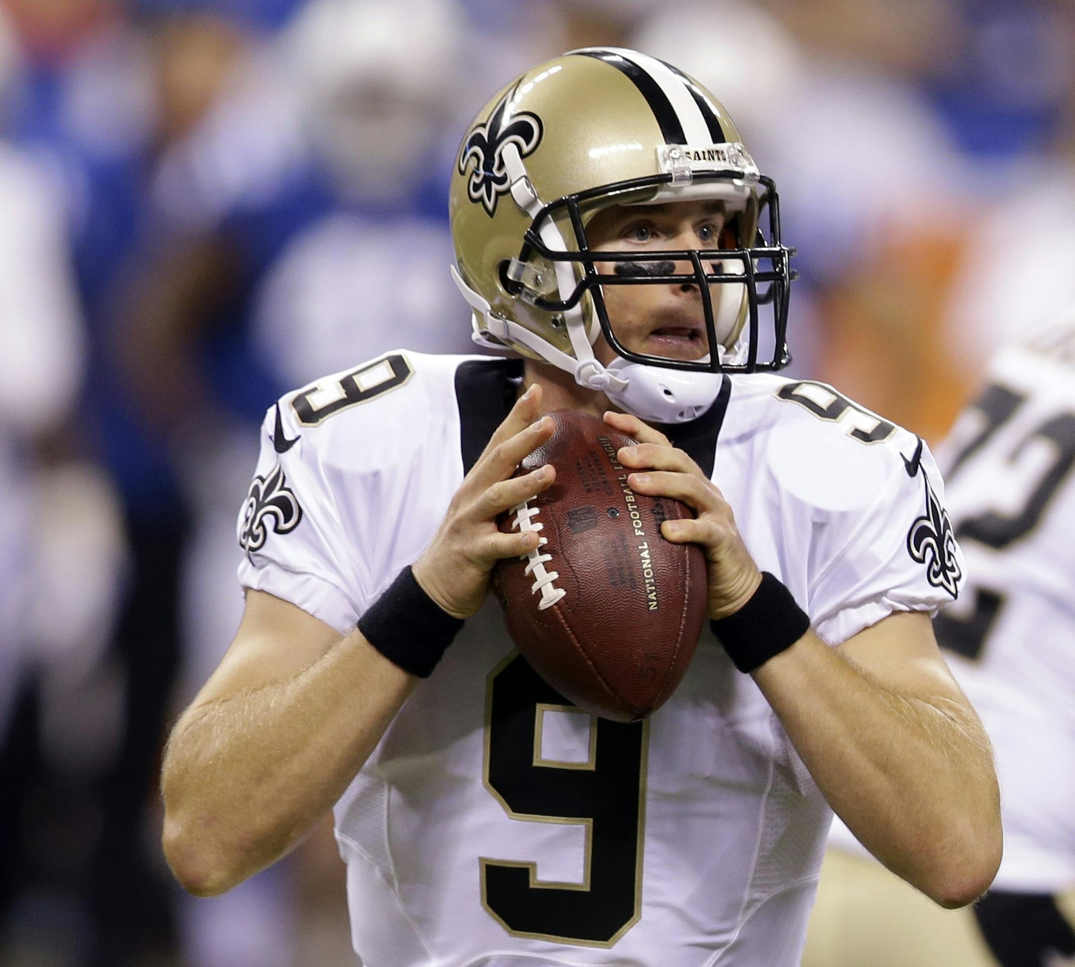 New Orleans Saints quarterback Drew Brees throws against the Indianapolis Colts during the first half of an NFL football game in Indianapolis, Saturday, Aug. 23, 2014. (AP Photo/Michael Conroy)