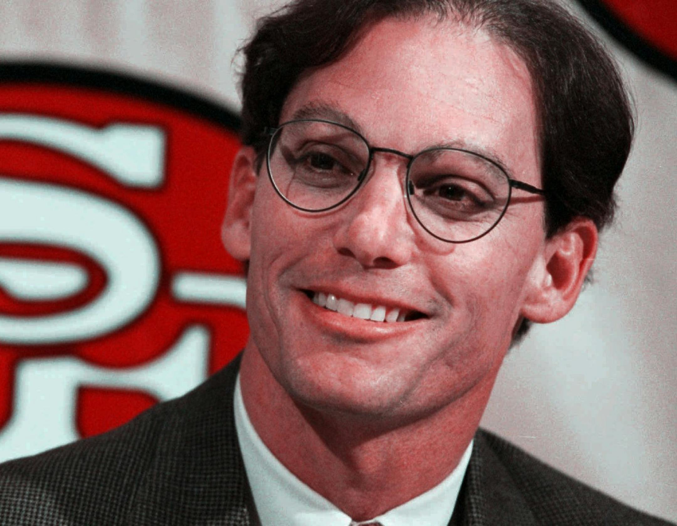 San Francisco 49ers new offensive coordinator Marc Trestman smiles during a news conference at the 49ers training camp in Santa Clara, Calif., Tuesday afternoon, Feb. 7, 1995. Trestman replaces Mike Shanahan, who was named as the head coach of the Denver Broncos last month. (AP Photo/Paul Sakuma) // The San Francisco 49ers assistant coach, interviewed Friday, has local times (12/10/96). (Trestman is a possible candidate for the U of M Gophers football coach.) ORG XMIT: MIN2013082821262531