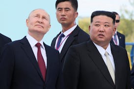 FILE - Russian President Vladimir Putin, left, and North Korea's leader Kim Jong Un examine a launch pad of Soyuz rockets during their meeting at the 