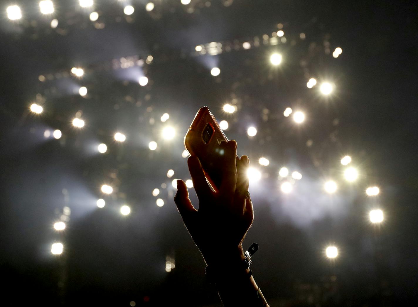 A fan held up cell photo as she waited for Luke Bryan to perform at US Bank Stadium. ] CARLOS GONZALEZ cgonzalez@startribune.com - August 19, 2016, Minneapolis, MN, First Concert at US Bank Stadium, Dustin Lynch, Little Big Town, Luke Bryan