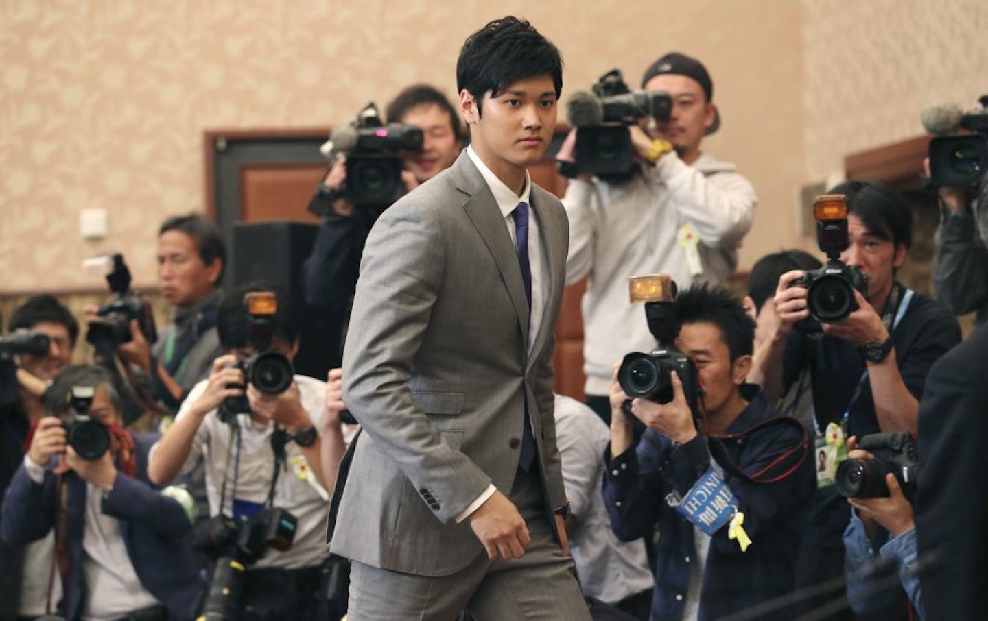 Japanese pitcher-outfielder Shohei Ohtani arrives for a press conference at Japanese National Press Center in Tokyo, Saturday, Nov. 11, 2017. Otani announced he wants to move to Major League Baseball next season.