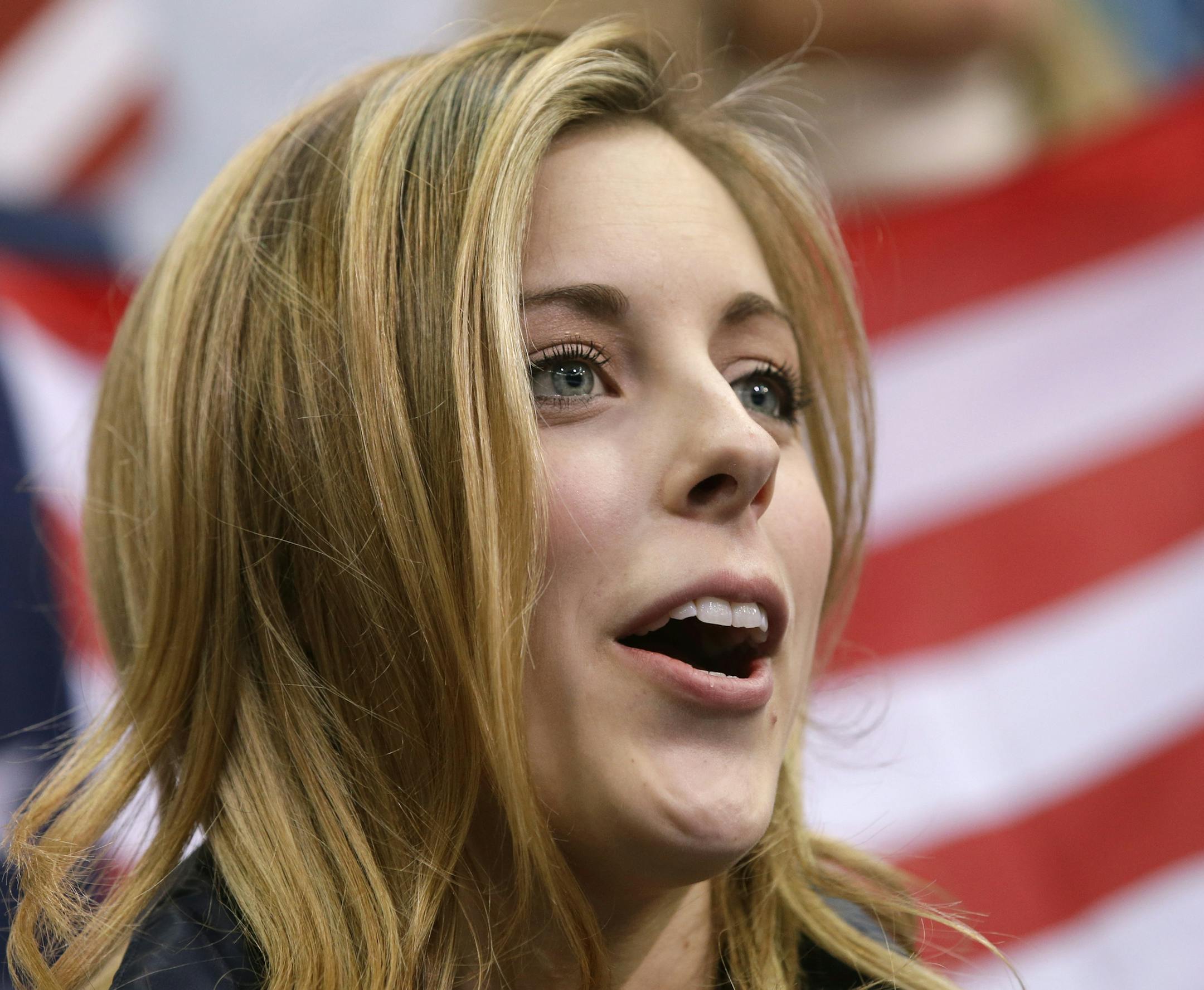 Ashley Wagner of the United States watches Jason Brown of the United States competes in the men's team free skate figure skating competition at the Iceberg Skating Palace during the 2014 Winter Olympics, Sunday, Feb. 9, 2014, in Sochi, Russia. (AP Photo/Darron Cummings, Pool)