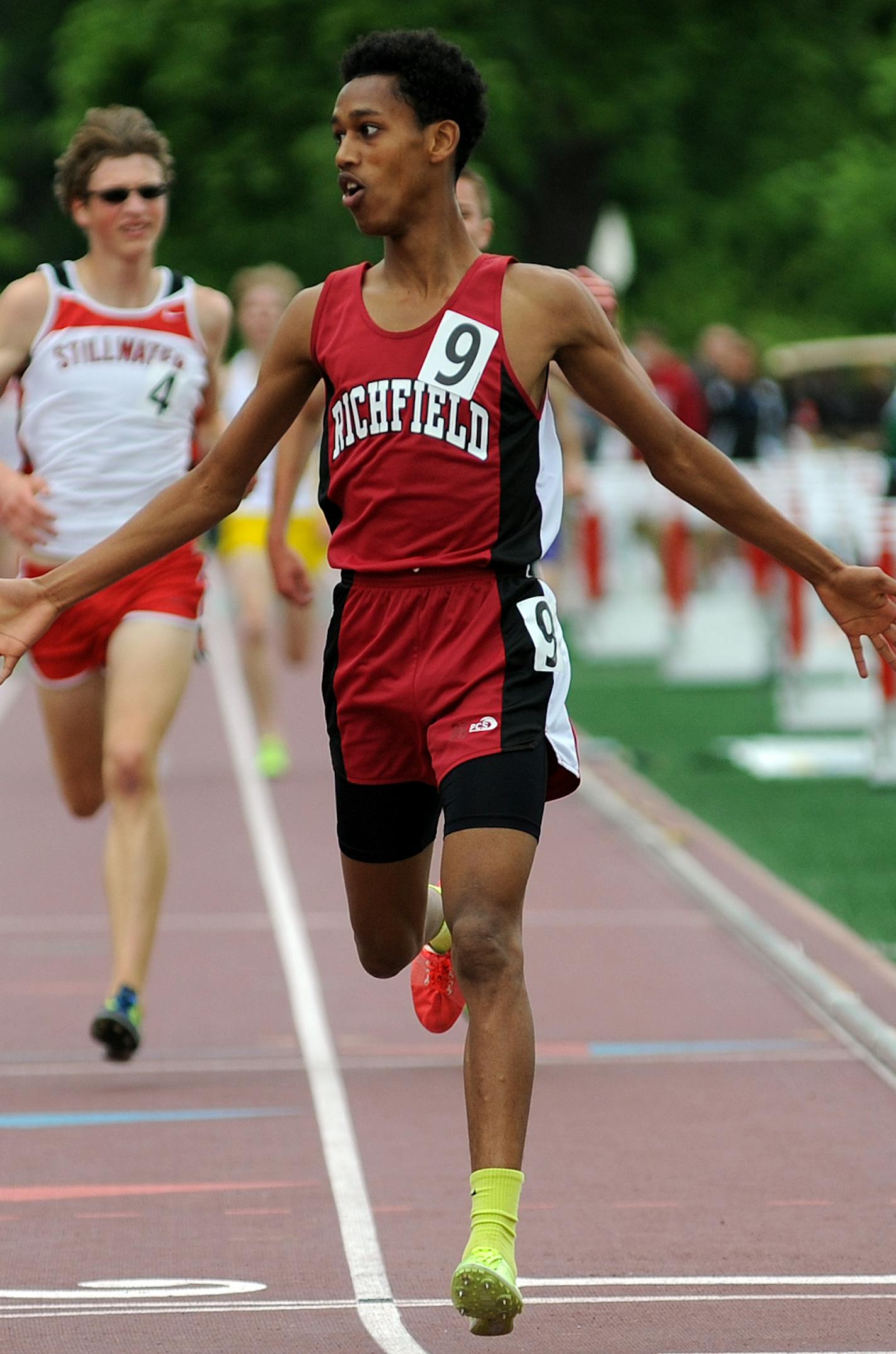 Obsa Ali of Richfield Number 9 crossed the finish line of the Boy's 2A3200 meters in record time at the State 2A track Meet at Hamline University Stadium in St Paul, Minn. Friday June 7, 2013] Richard.Sennott@startribune.com Richard Sennott/Star Tribune. , St Paul, Minnesota Friday 6/7/13) ** (cq)