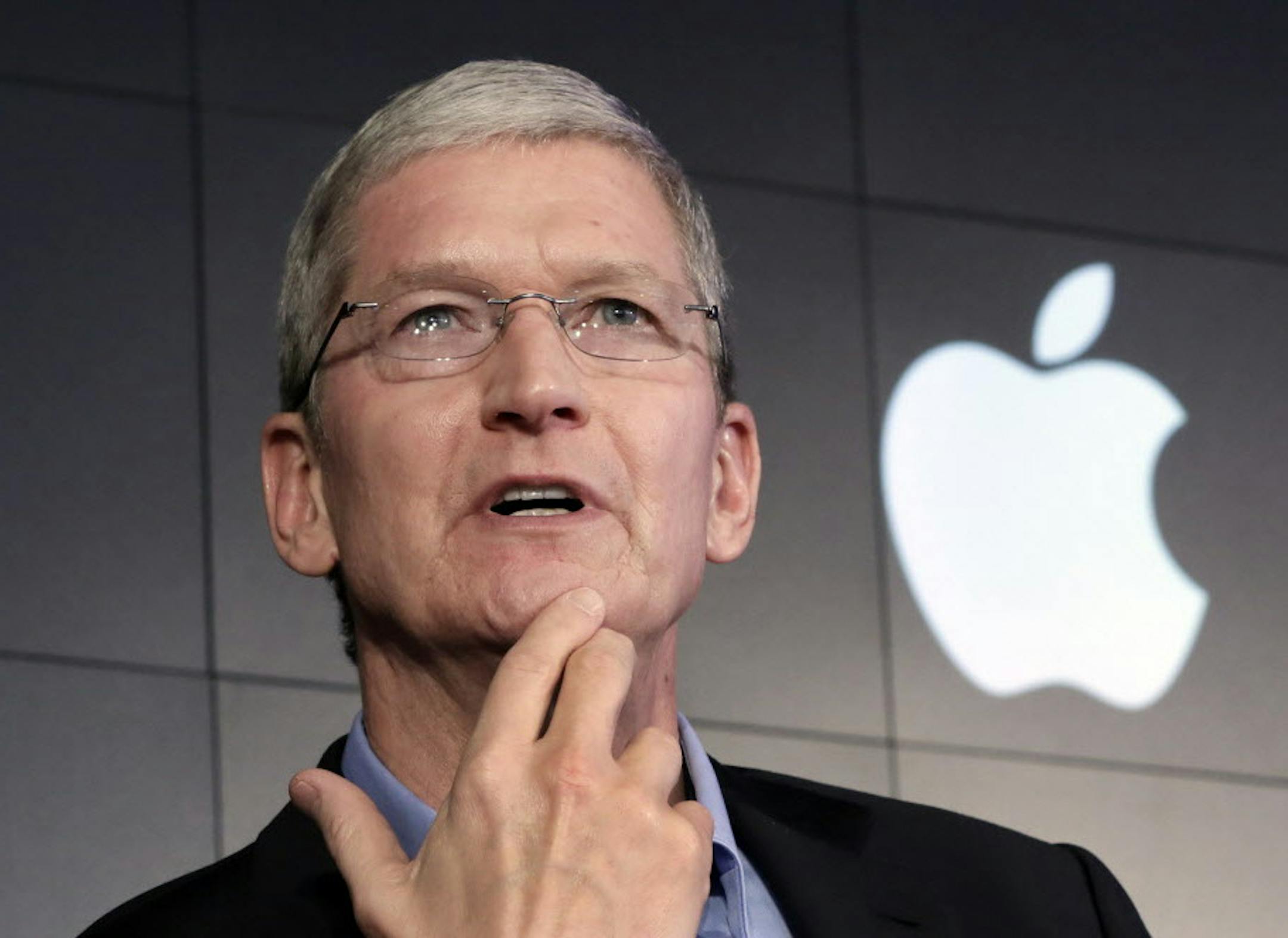 FILE - In this April 30, 2015 file photo, Apple CEO Tim Cook responds to a question during a news conference at IBM Watson headquarters, in New York. Apple has announced plans for a new product event on Sept. 9 in San Francisco, where the giant tech company is expected to show off new iPhones and other gadgets. Invitations for the event were sent to reporters and analysts Thursday, Aug. 27. In usual fashion, Apple is only hinting at what to expect. (AP Photo/Richard Drew)