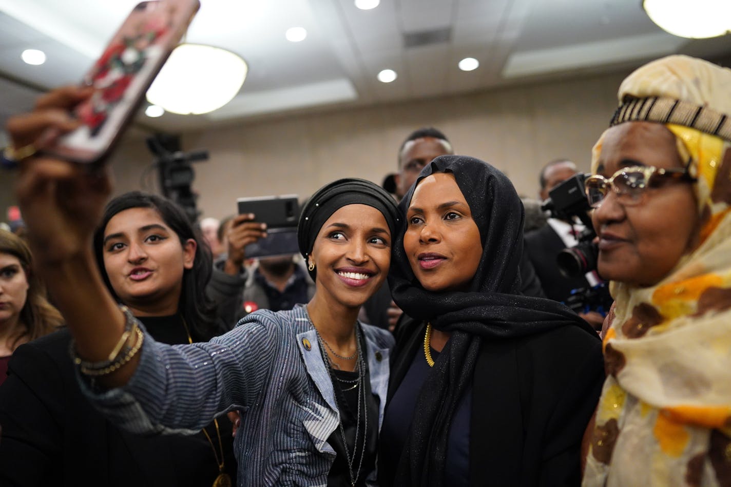 Ilhan Omar poses for a selfies with supporters after her victory Tuesday, Nov. 6, 2018, in Minneapolis. Omar is poised to become the first Somali-American elected to Congress, representing Minnesota's Fifth District.