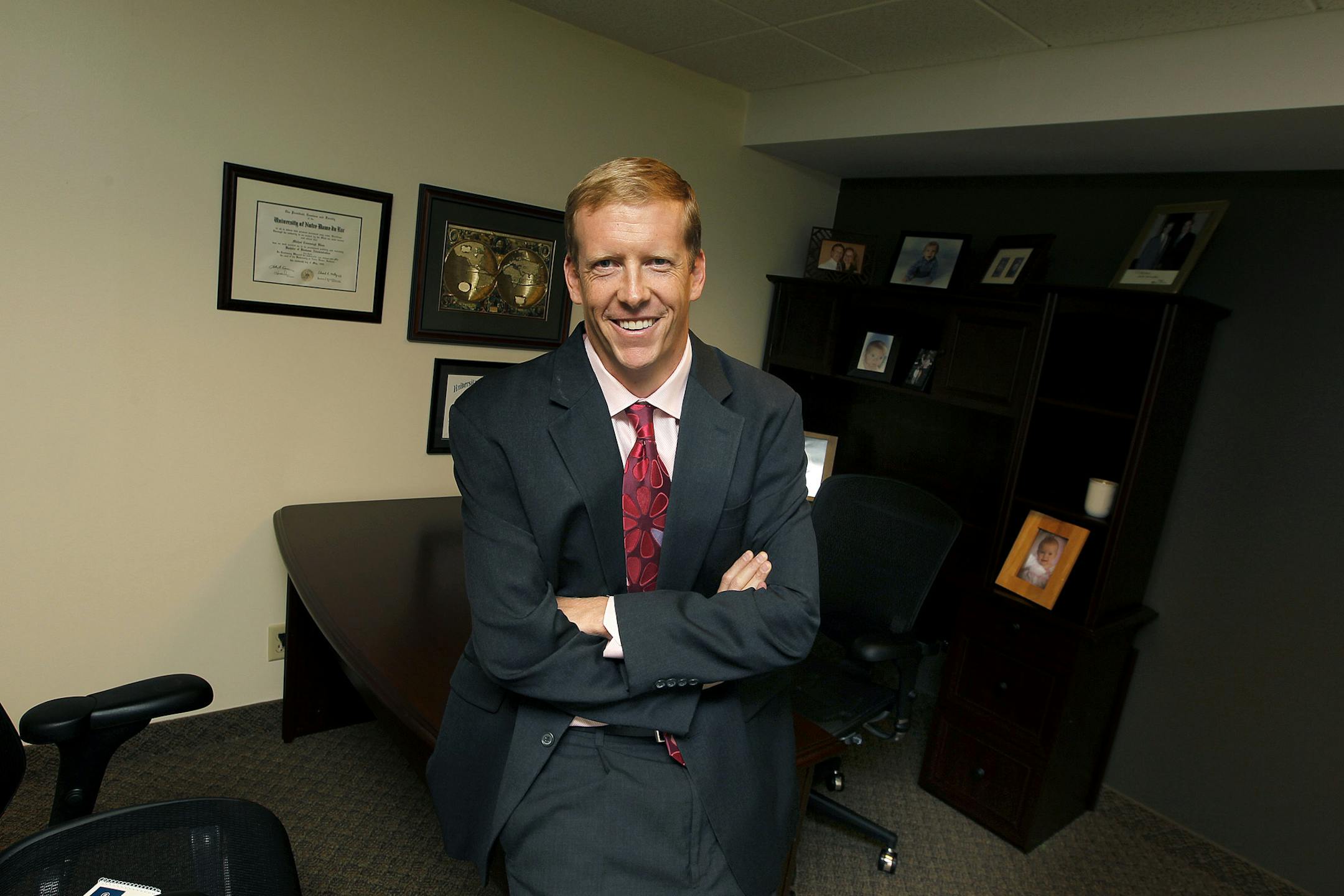 Michael Blaes is setting up a new office for Counsel on Call at the Calhoun Business Center, Thursday, September 5, 2013 in Minneapolis, MN. The Minneapolis legal market just got a tad more competitive with the arrival of Counsel on Call, a consortium of independent attorneys who contract with corporate clients to provide specific legal services. The national firm sees ample opportunity in the Twin Cities with its bevy of Fortune 500 companies dotting the landscape. (ELIZABETH FLORES/STAR TRIBUN
