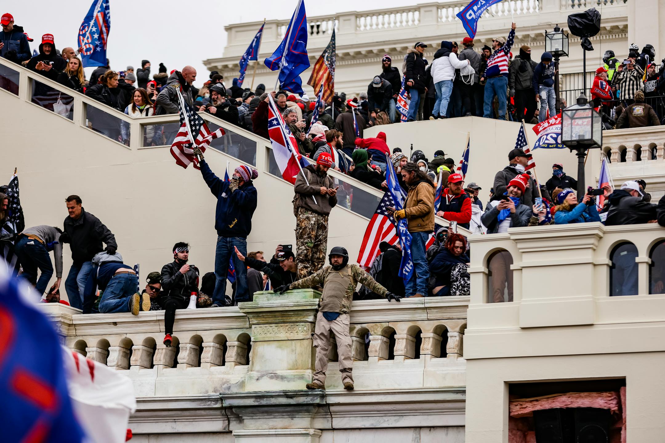 Pro-Trump supporters storm the U.S. Capitol following a rally with President Donald Trump on Wednesday, Jan. 6, 2021, in Washington, D.C. Congress held a joint session today to ratify President-elect Joe Biden's 306-232 Electoral College win over President Donald Trump. A group of Republican senators said they would reject the Electoral College votes of several states unless Congress appointed a commission to audit the election results. (Samuel Corum/Getty Images/TNS) ORG XMIT: 5286529W
