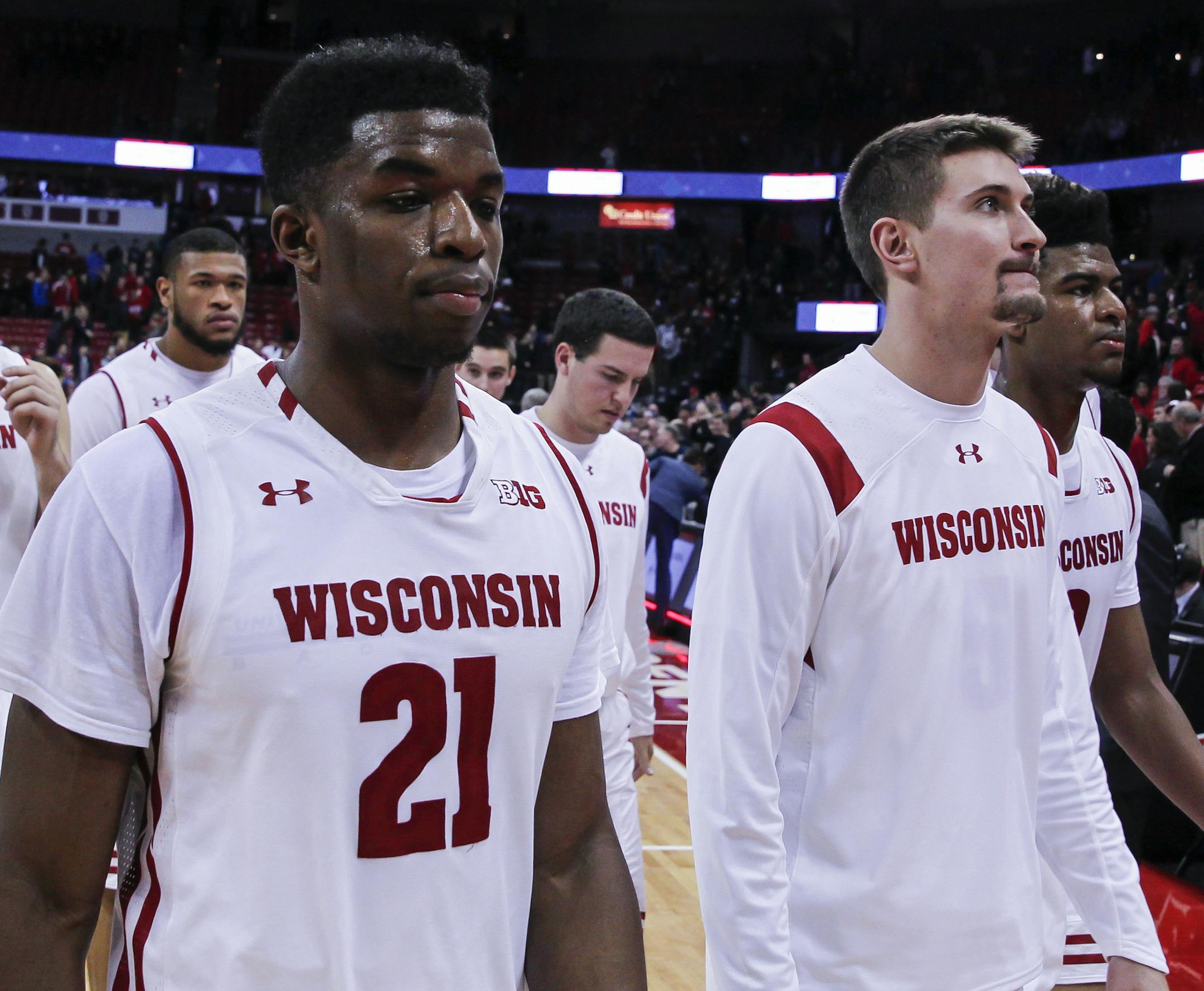 Wisconsin's Alex Illikainen (25), Khalil Iverson, second from left, Khalil Iverson (21), Aaron Moesch and Aleem Ford, right, walk off the court after the team's 80-70 loss to Xavier in an NCAA college basketball game Thursday, Nov. 16, 2017, in Madison, Wis. (AP Photo/Andy Manis) ORG XMIT: WIAM111