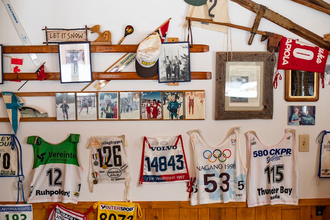 The inside of the Korkki Nordic Center warming house is decorated with old photos, bibs and skis.