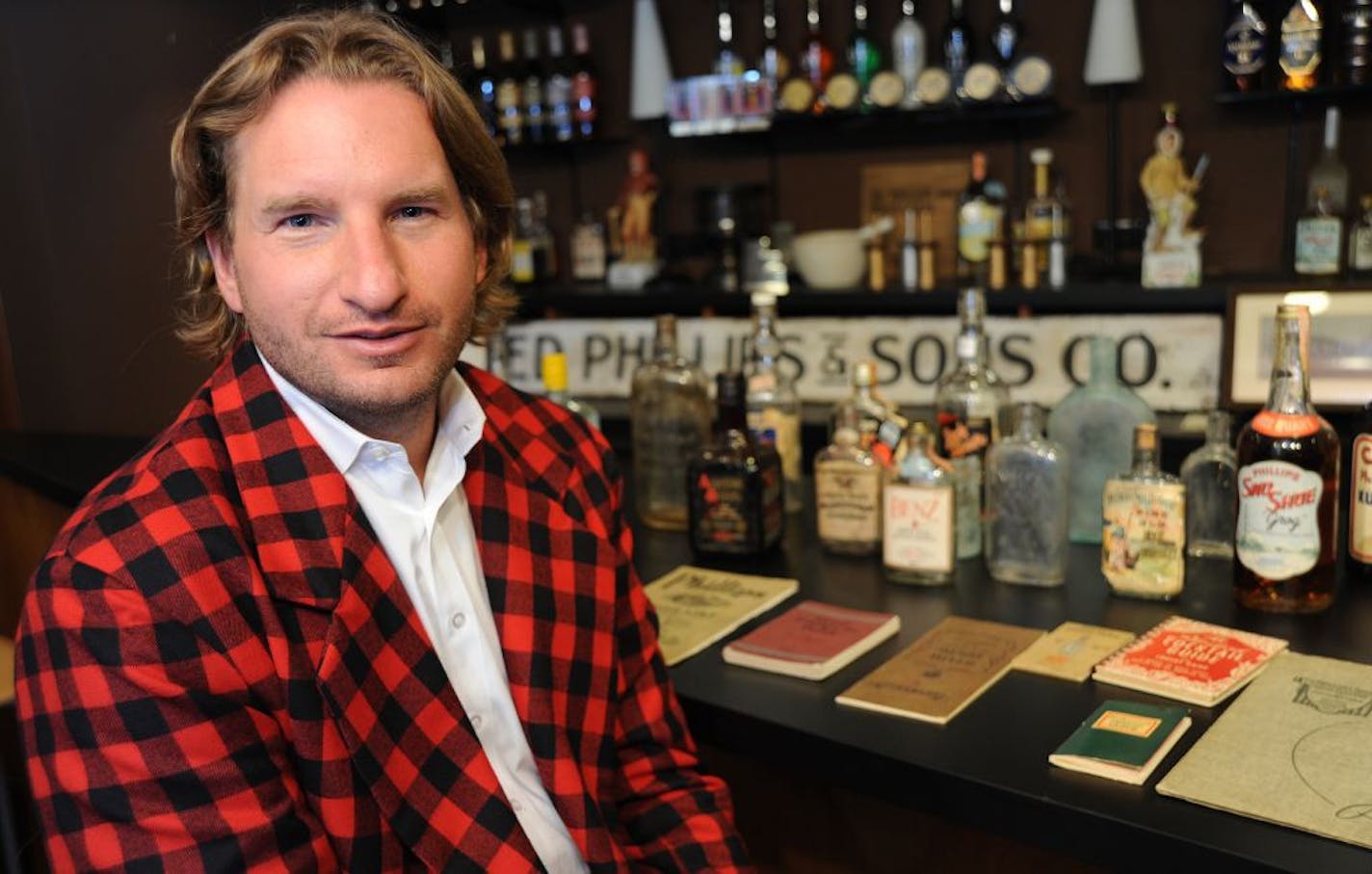 Dean Phillips, board member and brand ambassador for 100-year-old Minneapolis-based Phillips Distilling Co., collects old liquor paraphernalia. "Some people like Warhols," he said. "I like whiskey bottles."