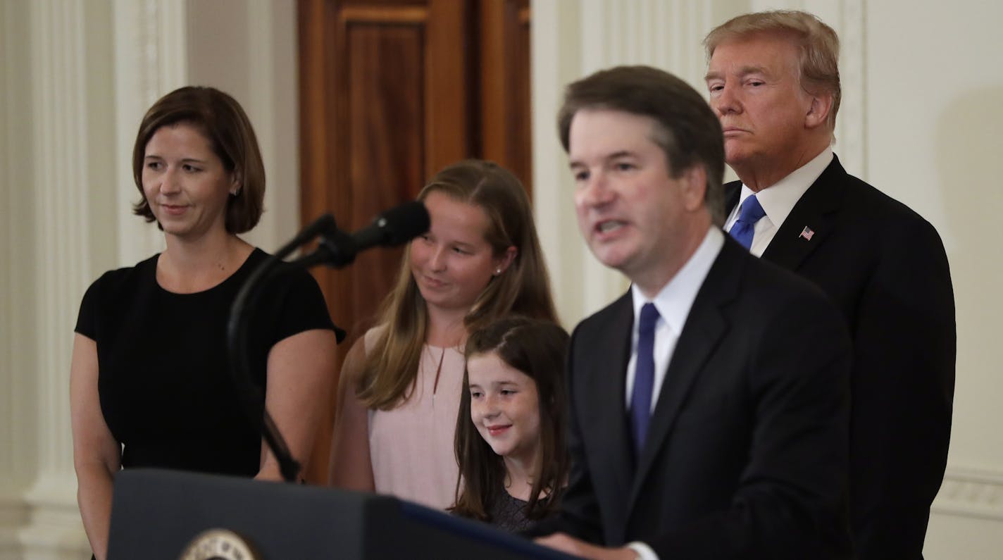 President Donald Trump listens as Judge Brett Kavanaugh, his Supreme Court nominee, speaks in the East Room of the White House, Monday, July 9, 2018, in Washington. (AP Photo/Evan Vucci)