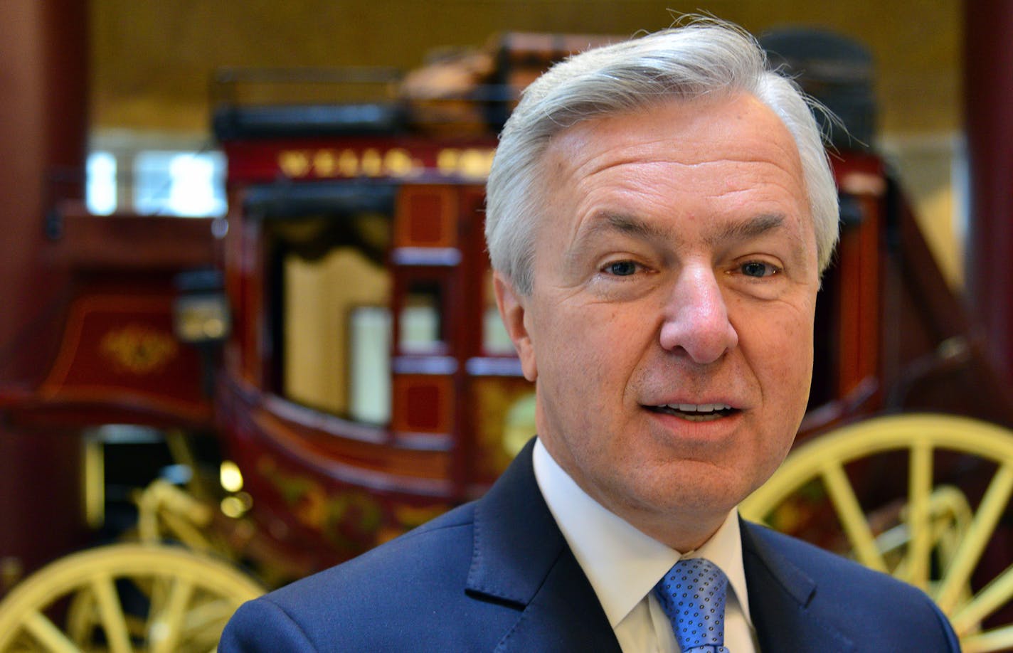 John Stumpf, Wells Fargo CEO, was in Minneapolis for the groundbreaking of the new office project near the Vikings stadium. and posed with the Wells Fargo stagecoach in the lobby of the Minneapolis headquarters.] Richard.Sennott@startribune.com Richard Sennott/Star Tribune Minneapolis Minn. Monday 5/13/2014) ** (cq)