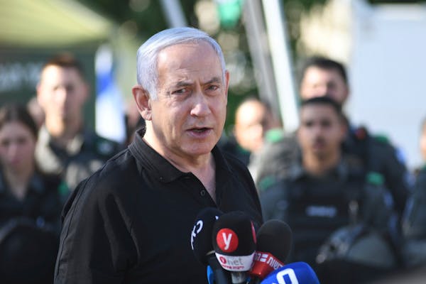 Israeli Prime Minister Benjamin Netanyahu met with Israeli border police on Thursday, May 13, 2021, in Lod, near Tel Aviv, after a wave of violence in