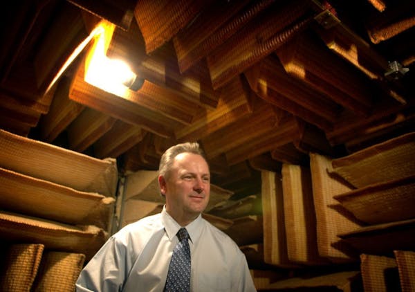 Former President Jerry Ruzicka, shown in 2006 in the company's soundproof room where hearing aides are tested, was one of four Starkey Hearing Technol
