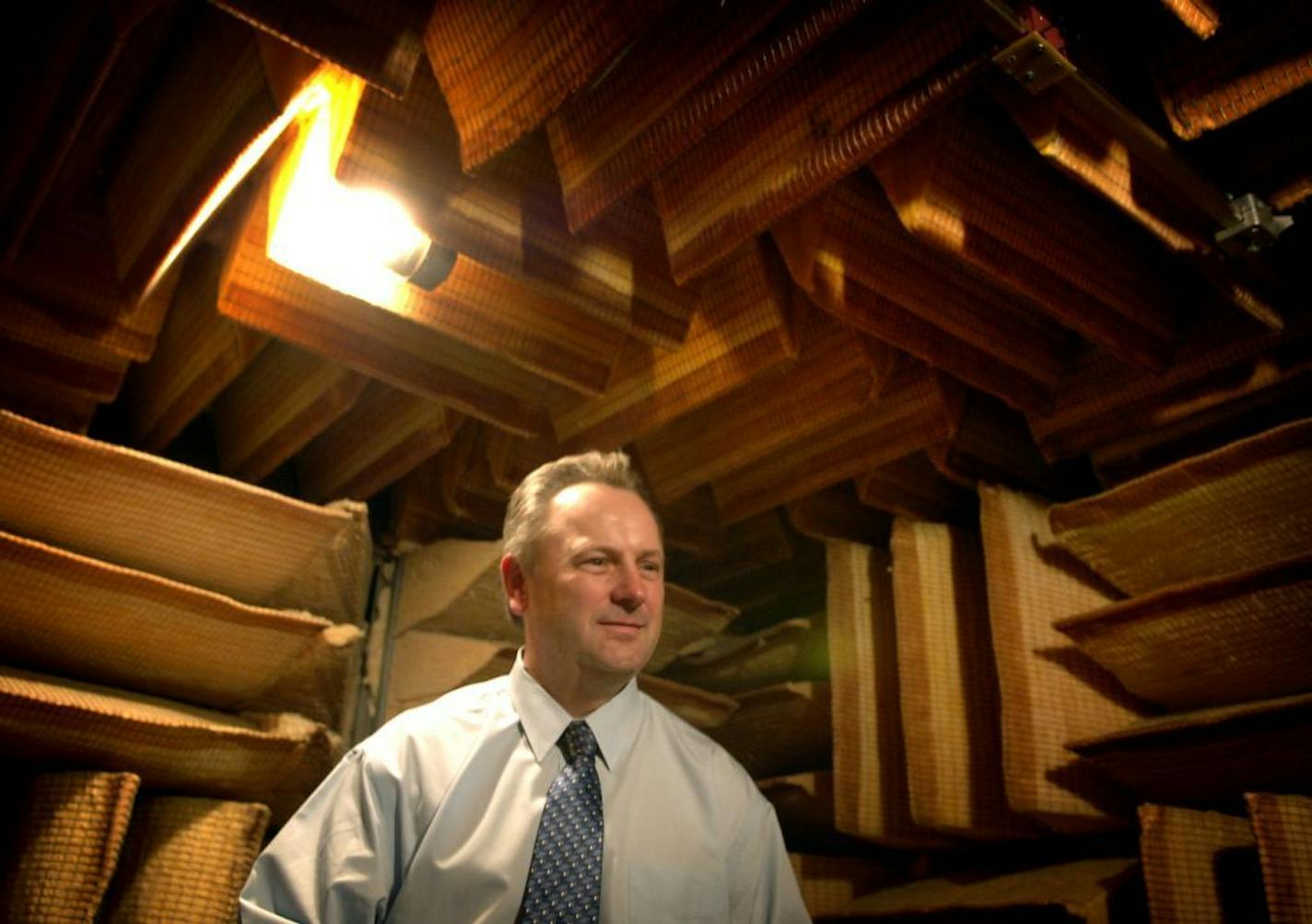 Former President Jerry Ruzicka, shown in 2006 in the company's soundproof room where hearing aides are tested, was one of four Starkey Hearing Technologies executives whose names were removed from the company website Wednesday.